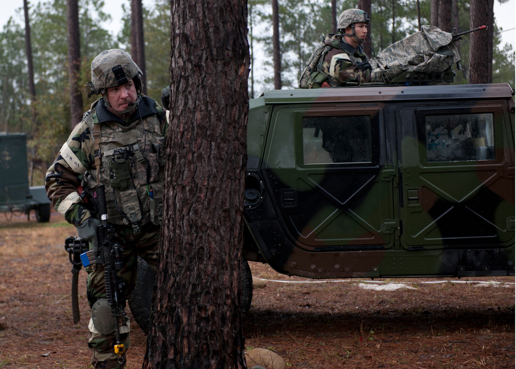 U.S. Air Force Capt. George Hern, 23rd Security Forces Squadron, left, conducts surveillance of opposing forces with a patrol team during a phase II operational readiness exercise at the field training exercise site Jan. 11, 2012, at Moody Air Force Base, Ga. The drill tested the Airmen’s ability to react to enemy activity. Members of Team Moody are preparing for an operational readiness inspection being held this spring and will undergo two more OREs before then. (U.S. Air Force photo by Senior Airman Eileen Meier/Released)