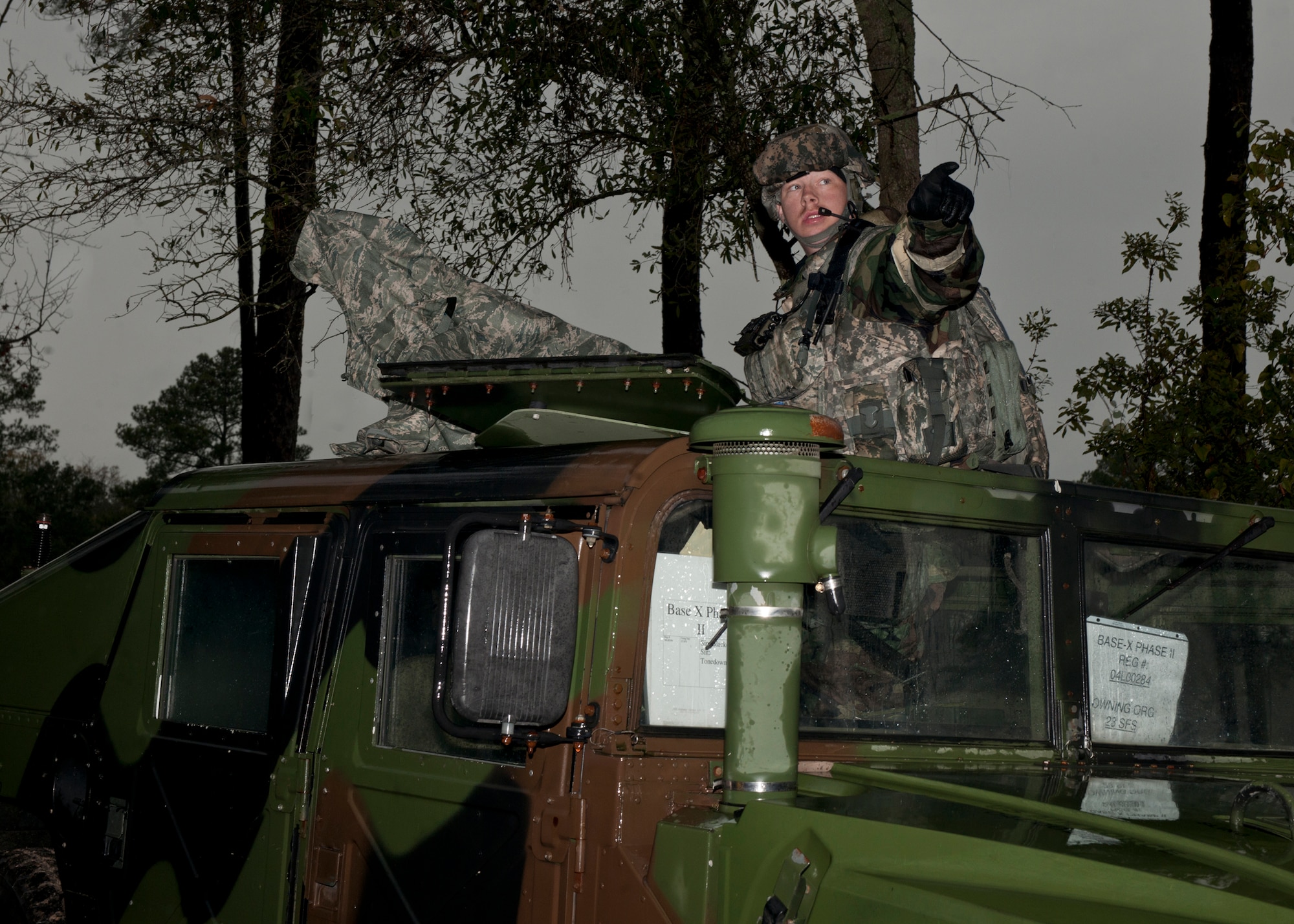 U.S. Air Force Airman 1st Class Jacob Haskins, 23rd Security Forces Squadron, points to the location of gunshots fired by opposing forces during a phase II operational readiness exercise at the field training exercise site Jan. 11, 2012, at Moody Air Force Base, Ga. Team Moody conducts OREs in preparation for the operational readiness inspection this spring. (U.S. Air Force photo by Senior Airman Eileen Meier/Released)