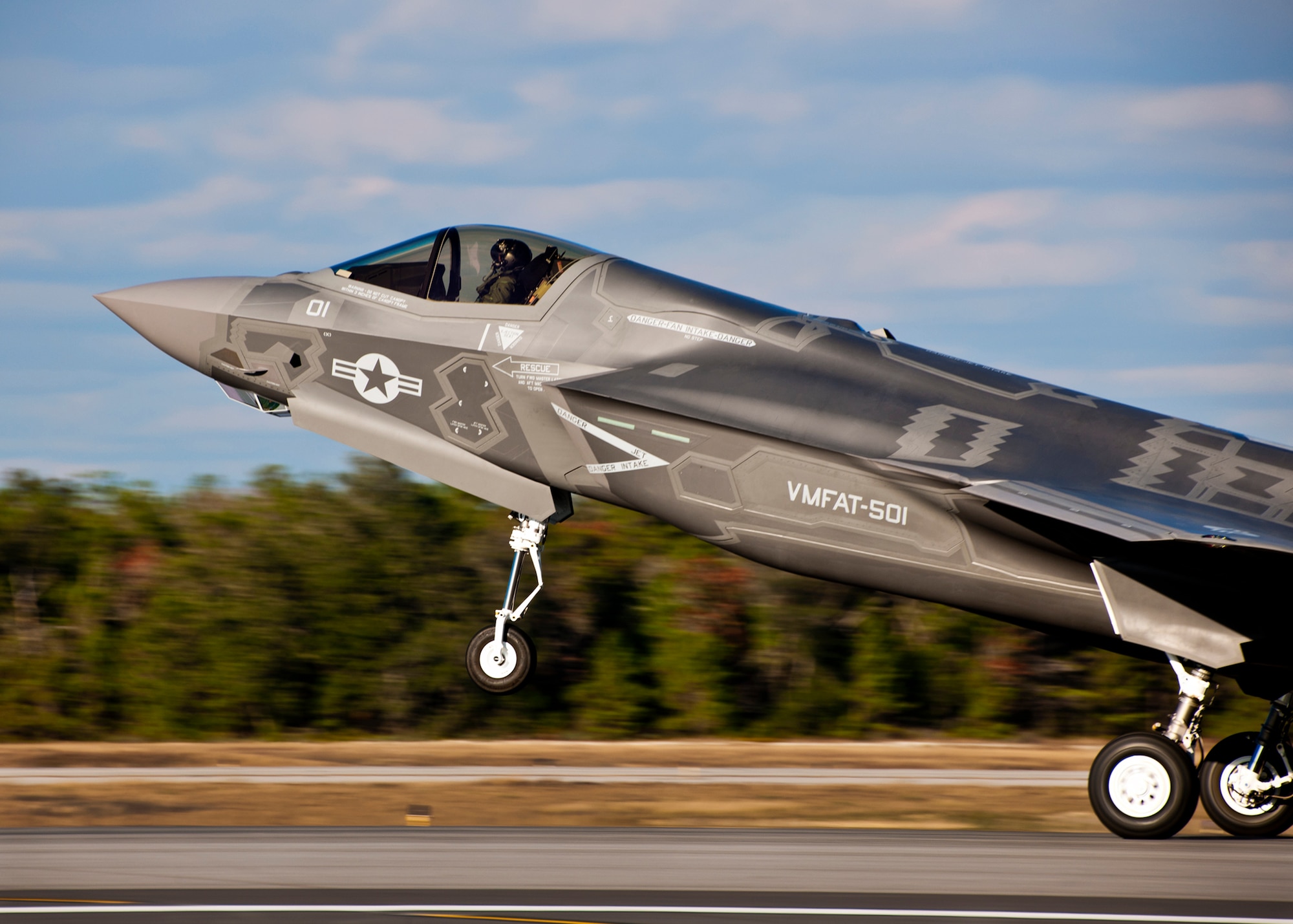 The Marine Corp’s newest aircraft, the F-35B Lightning II joint strike fighter touches down at its new home at Eglin Air Force Base, Fla.  The newest aircraft in the Department of Defense inventory belongs to Marine Fighter Attack Squadron 501. The Marines of VMFAT-501 received two F-35Bs Jan. 11.  Both aircraft were escorted in by Marine F-18 Hornets.  (U.S. Air Force photo/Samuel King Jr.)