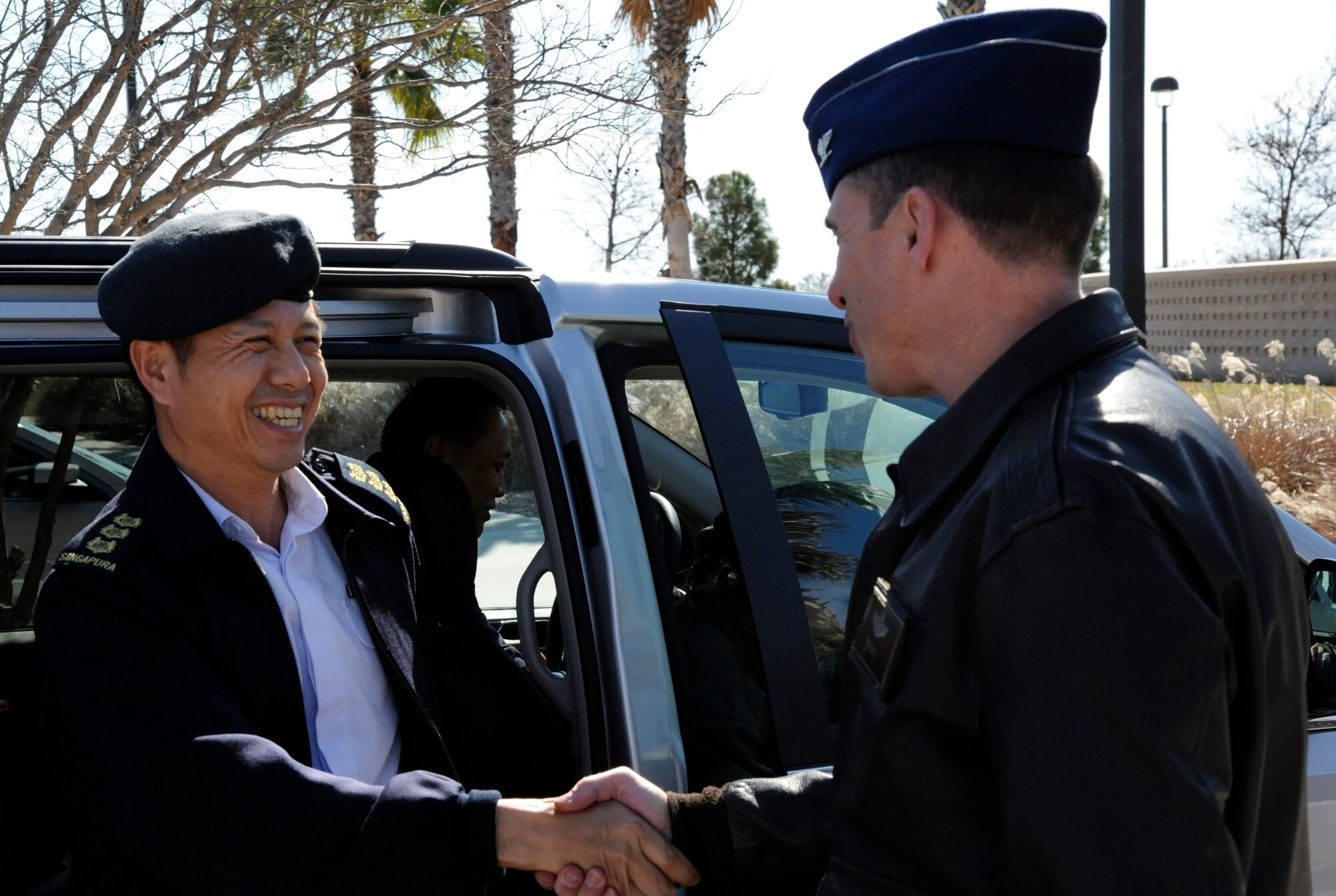 LAUGHLIN AIR FORCE BASE, Texas – Col. Kok Siong Lim, Singapore’s Air Force Training Command commander, is greeted by Col. Tom Murphy, 47th Flying Training Wing commander, at the Laughlin Manor Jan. 10. Lim and his accompanying group came to Laughlin to visit Specialized Undergraduate Pilot Training students from Singapore. (U.S. Air Force photo/Airman 1st Class Nathan L. Maysonet)