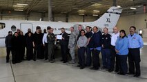 LAUGHLIN AIR FORCE BASE, Texas – Ector Cienega, 47th Maintenance Directorate work leader tools and parts attendant, poses with Col. Tom Murphy, 47th Flying Training Wing commander, and Chief Master Sgt. Ray DeVite, 47th FTW command chief, after being presented the XLer of the week award here Dec. 21. The XLer is a weekly award chosen by wing leadership and given to those who consistently make outstanding contributions to Laughlin and their unit. (U.S. Air Force photo/Airman 1st Class Nathan L. Maysonet)