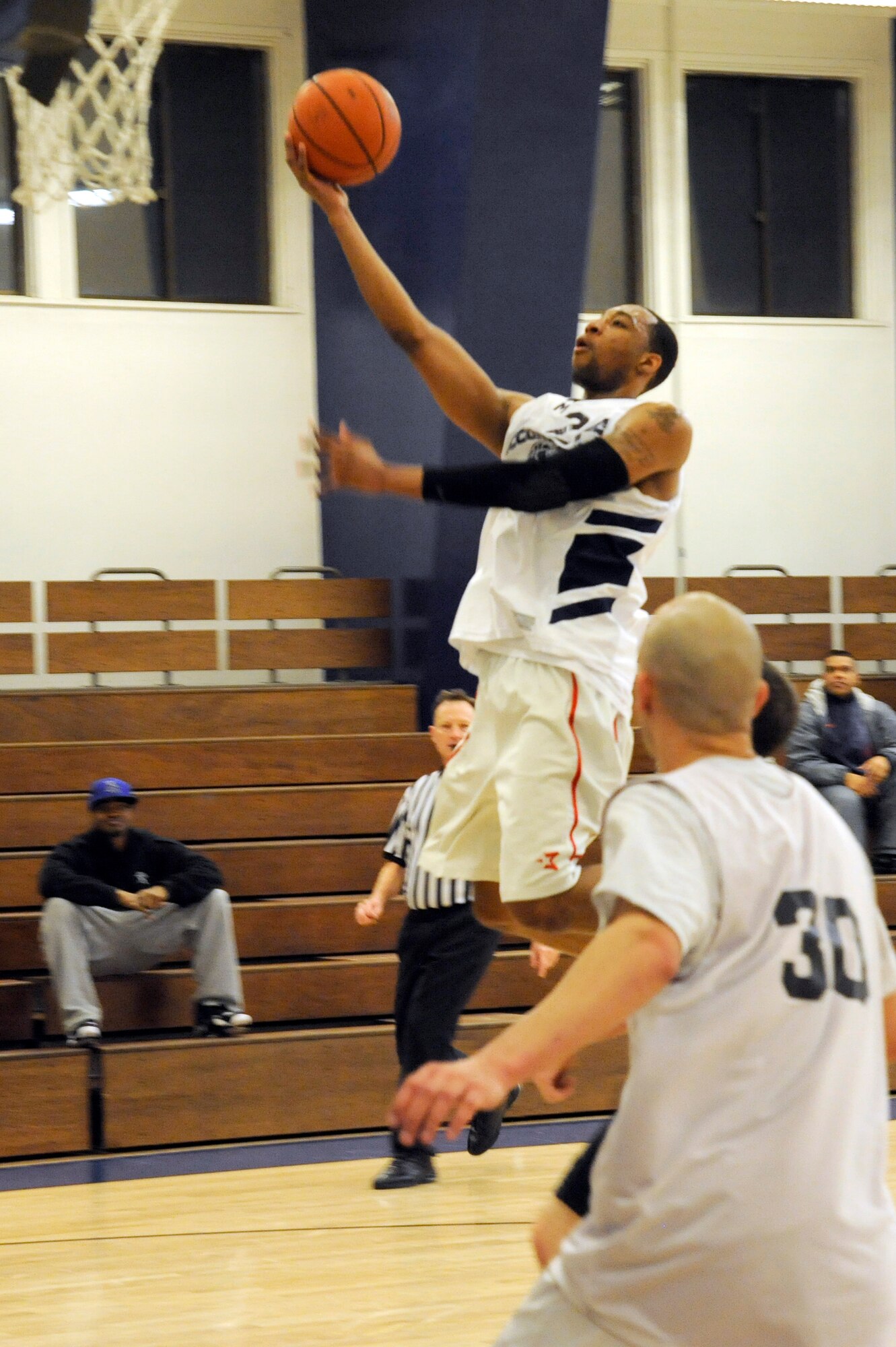 MISAWA AIR BASE, Japan - Dominique Barrett, Misawa Security Operations Center team member, makes a two-point jump shot during the base intramural basketball championship game held at the Potter Fitness Center here, Jan. 11. The MSOC defeated the 35th Medical Group 55-49 in overtime of game two of the double elimination tournament. (U.S. Air Force photo/Tech. Sgt. Marie Brown)