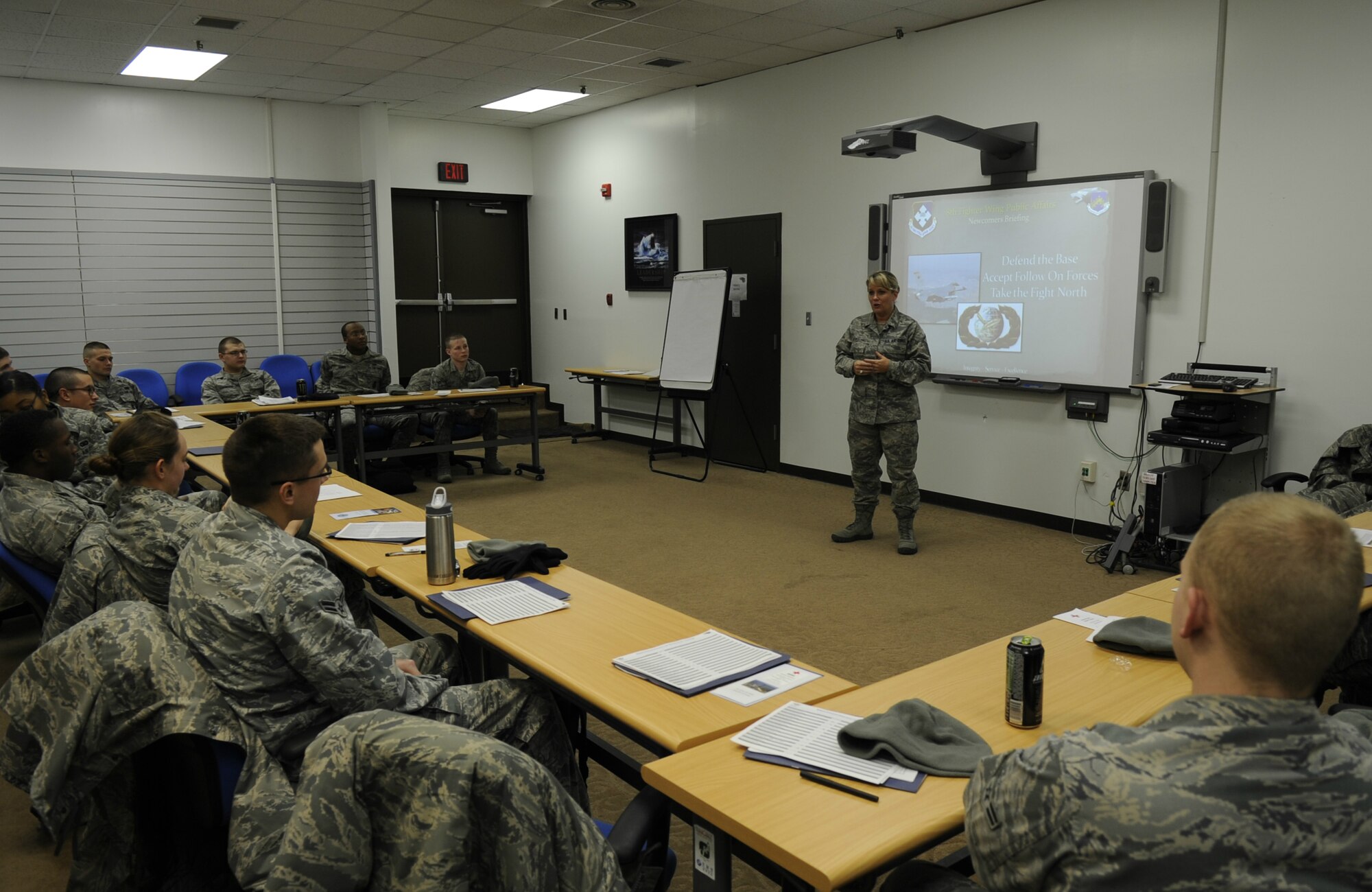 Master Sgt. Jessica Woodruff, 8th Force Support Squadron career assistance advisor, talks with a group of first-term Airmen about career opportunities and where they should go to find them at Kunsan Air Base, Republic of Korea, Jan. 10, 2012. Woodruff volunteered for a special duty assignment as a career assistance advisor at Kunsan, where she helps educate all Airmen on career opportunities and information. (U.S. Air Force photo by Senior Airman Jessica Hines/Released)