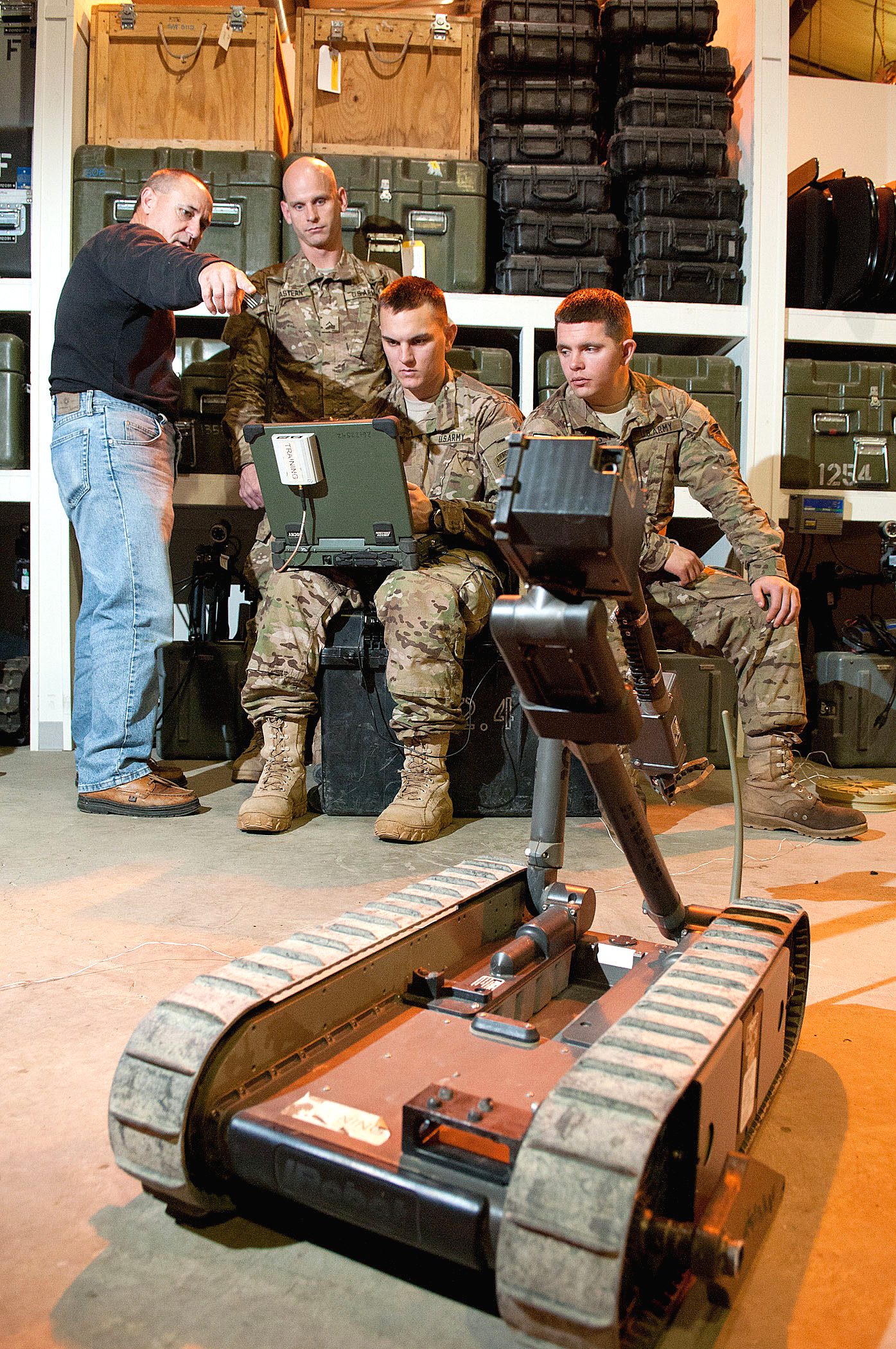 A civilian trainer explains how to setup the operating display for the ...