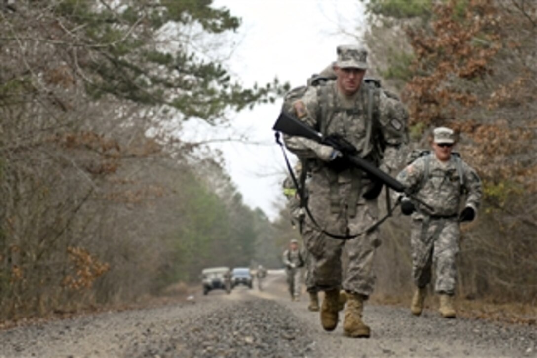 U.S. Army Cpl. Bryan Kyle, a combat engineer with the 688th Engineer Company, 489th Engineer Battalion, 420th Engineer Brigade, road marches during a battalion-level Best Warrior Competition at Camp Pike, Ark., on Jan. 7, 2012.  Kyle will represent his battalion during the next phase of the competition.  