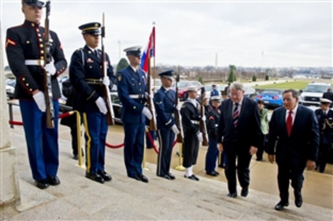 U.S. Defense Secretary Leon E. Panetta escorts Dutch Defense Minister Hans Hillen through an honor cordon into the Pentagon, Jan. 12, 2012. Panetta and Hillen met to discuss the new U.S. defense strategic guidance, bilateral defense cooperation issues, and ongoing operations in Afghanistan and plans for transition. 