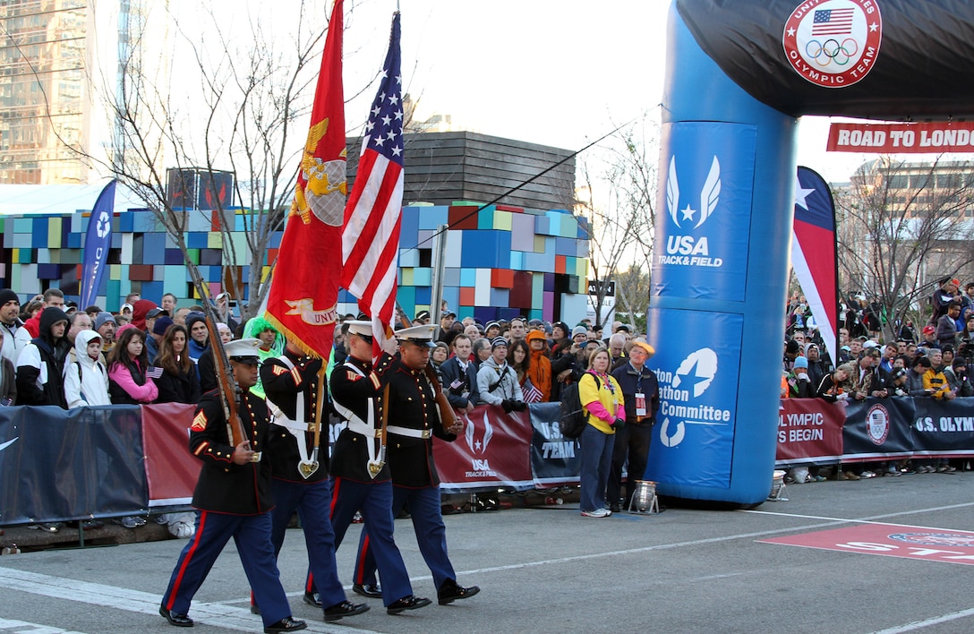 A Marine Corps color guard consisting of Sgt. Jesus E. Marquez, Sgt. Thomas J. Sandoval, Sgt. Joseph R. Buehlman and Sgt. Marcelino R. Andrade Jr., all canvassing recruiters with Recruiting Station Houston, present the national colors at the opening of the 2012 Olympic Trials Marathon, in Houston, Texas, Jan. 14.