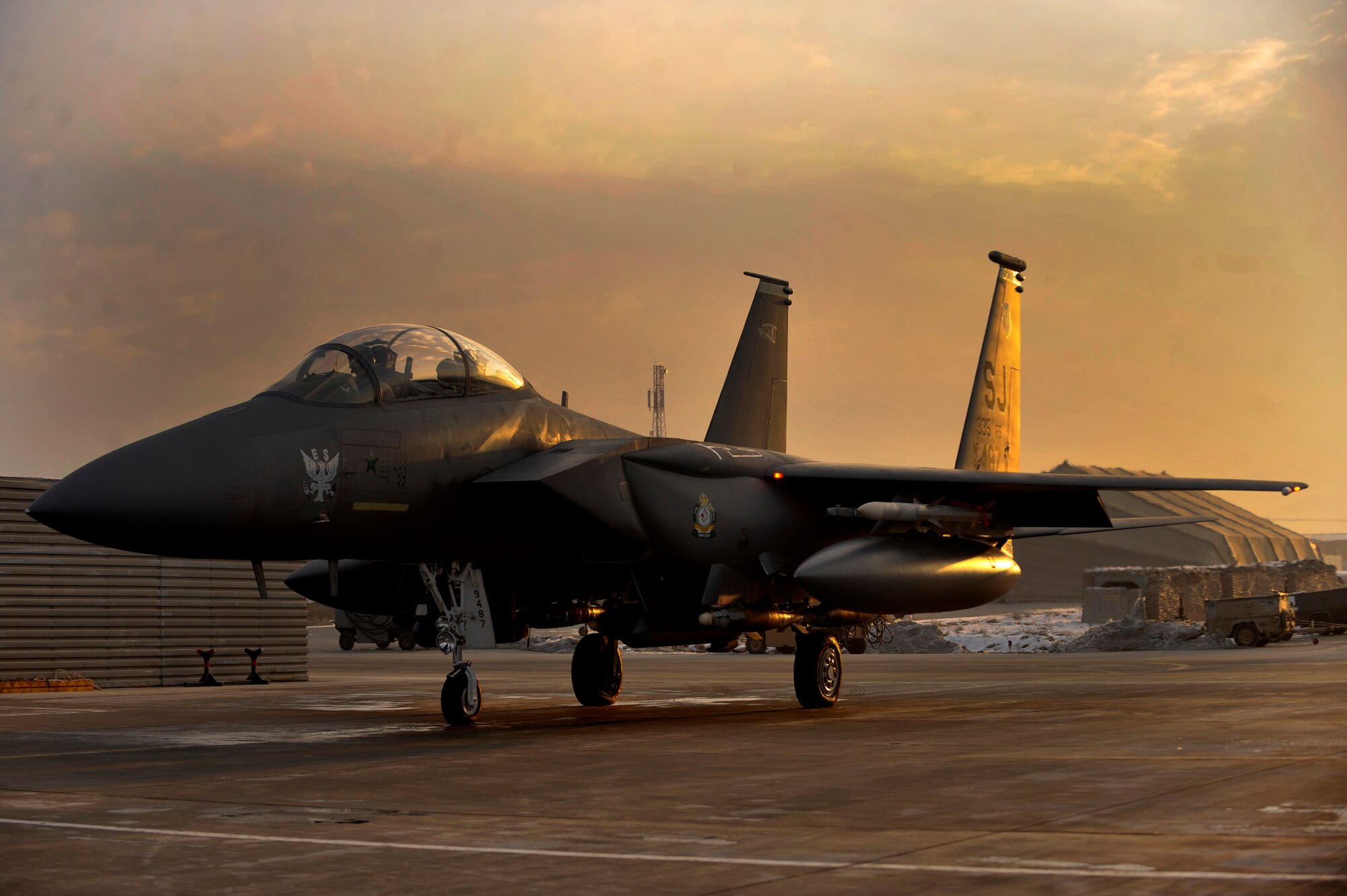 BAGRAM AIRFIELD, Afghanistan-- F-15E Strike Eagle #89-0487 sits in its spot at Bagram Airfield, Afghanistan, Jan. 13, 2012. #89-0487 is a highly credited aircraft, being the only F-15E to successfully complete an air-to-air kill; an achievement that the aircraft reached in 1991 while serving in Operation Desert Storm, and now the only F-15E to log 10,000 hours of flying time. (U.S. Air Force photo/ Airman 1st Class Ericka Engblom)