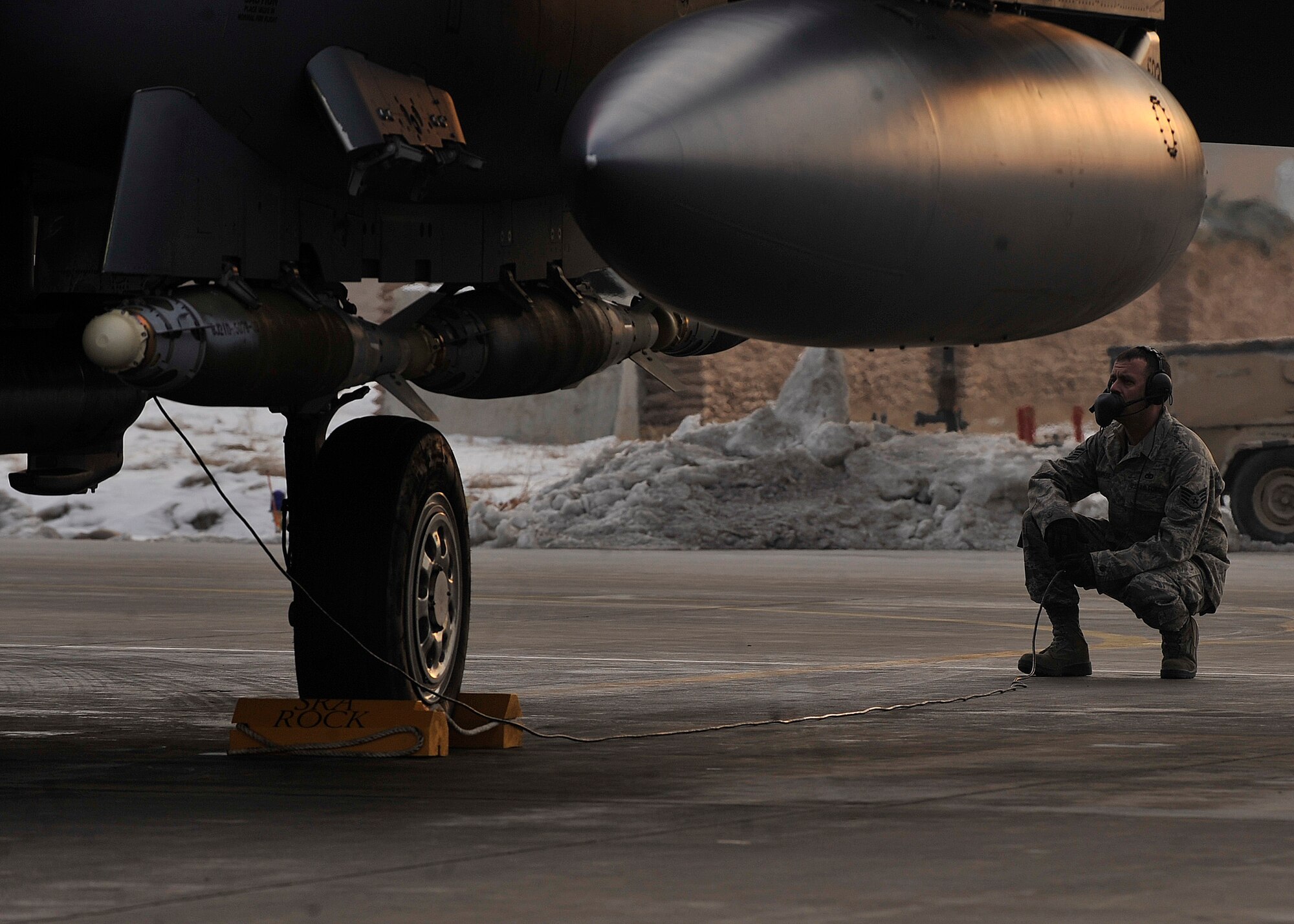 BAGRAM AIRFIELD, Afghanistan— Staff Sgt. Ryan Forsse performs final checks on the F-15E Strike Eagle #89-0487 before it departs for the mission that will bring its flying hours up to 10,000 at Bagram Airfield, Afghanistan, Jan. 13, 2012. Forsse is a crew chief with the 455th Expeditionary Aircraft Maintenance Squadron and is deployed from Seymour-Johnson Air Force Base, N.C. (U.S. Air Force photo/ Airman 1st Class Ericka Engblom)