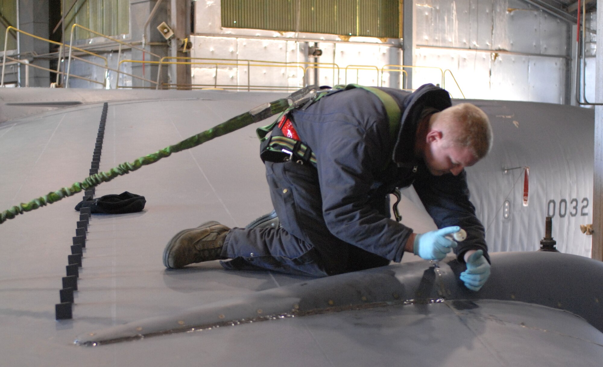 Staff Sgt. Joshua Engel, 96th Aircraft Maintenance Unit, applies a two-part sealant to the beaver tail panels on a B-52H Stratofortress on Barksdale Air Force Base, La., Jan. 12. Engel applied the sealant to keep air from entering the aircraft while in flight . (U.S. Air Force photo/ Airman 1st Class Joseph A. Pagán Jr.)(RELEASED)
