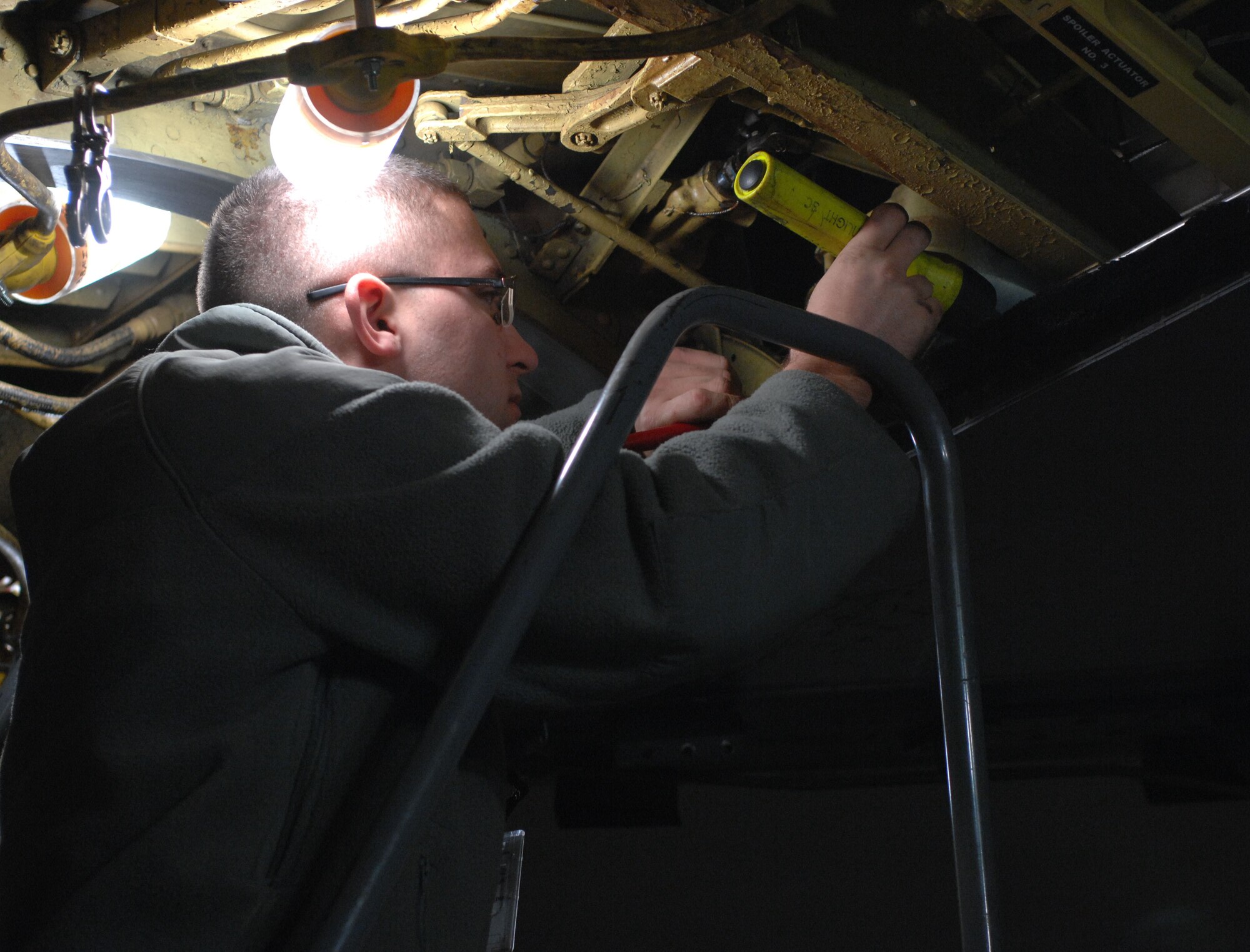 Airman 1st Class Trevor Howell, 2nd Maintenance Squadron, inspects the left wing of a B-52H Stratofortress inside a hangar on Barksdale Air Force Base, La., Jan. 12. Howell is checking for corrosion, cracks, rust and any foreign objects. (U.S. Air Force photo/Airman 1st Class Joseph A. Pagán Jr.)(RELEASED)