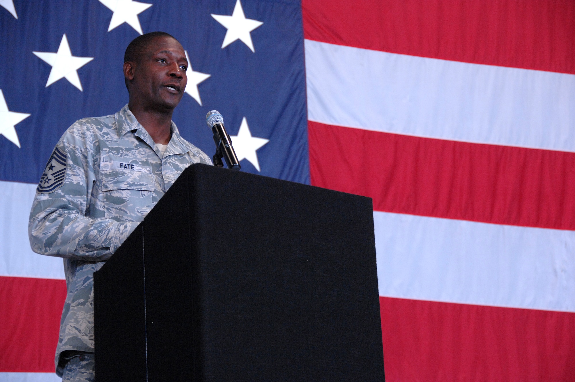 U.S. Air Force 20th Fighter Wing Command Chief Master Sgt. Lefford Fate introduces Congressman James E. Clyburn at the Martin Luther King Luncheon, Shaw Air Force Base, S.C., Jan. 13, 2012. The luncheon is an annual event held to celebrate and remember King and the impact he had on the United States of America. (U.S. Air Force photo by Airman 1st Class Blake Hubbard/Released)
