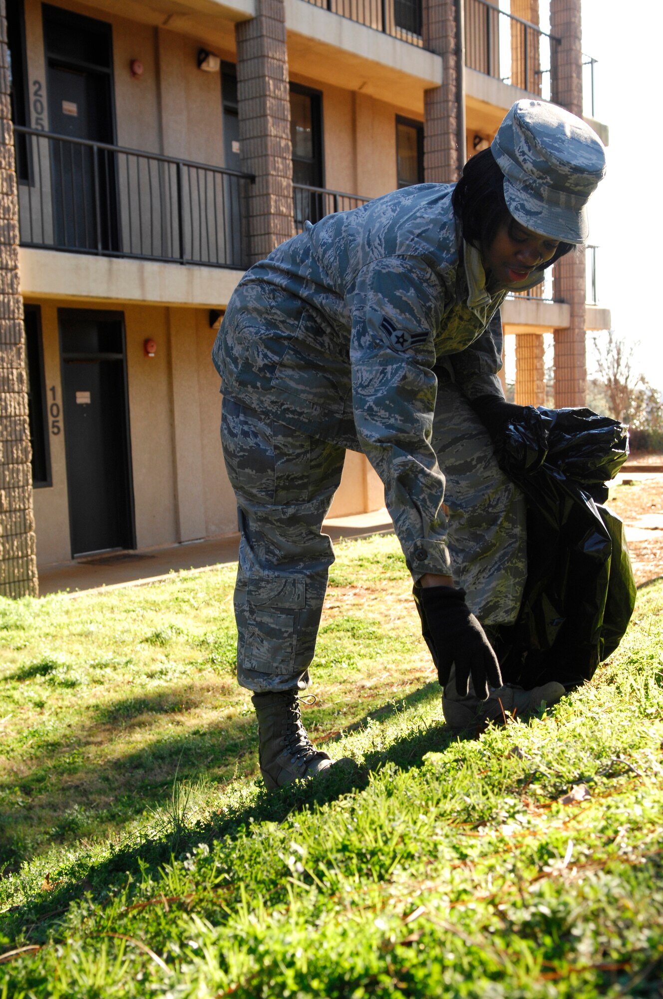 U.S. Air Force Airman 1st Class Candice Moore, 20th Medical Operations Squadron, cleans up the dormitory grounds for bay orderly, Shaw Air Force Base, S.C., Jan.13, 2012. Bay orderly is a weeklong extra duty where dorm residents ensure their living quarters are clean and in inspection order. (U.S. Air Force photo by Airman 1st Class Ashley L. Gardner/Released)