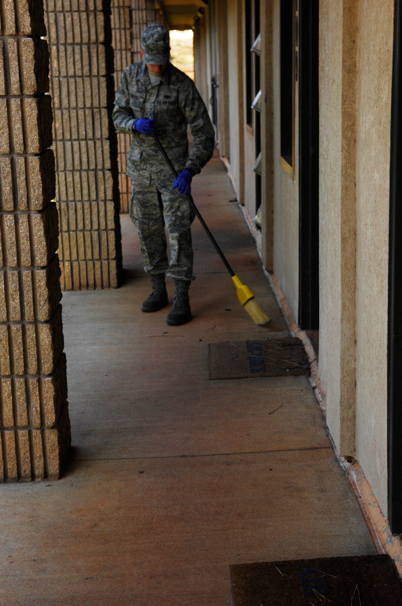 U.S. Air Force Airman Sean Nagel, 20th Aircraft Maintenance Squadron, sweeps a section of the dormitory during bay orderly, Shaw Air Force Base, S.C., Jan.13, 2012. Bay orderly is a weeklong extra duty where dorm residents ensure their living quarters are clean and in inspection order. (U.S. Air Force photo by Airman 1st Class Ashley L. Gardner/Released)

