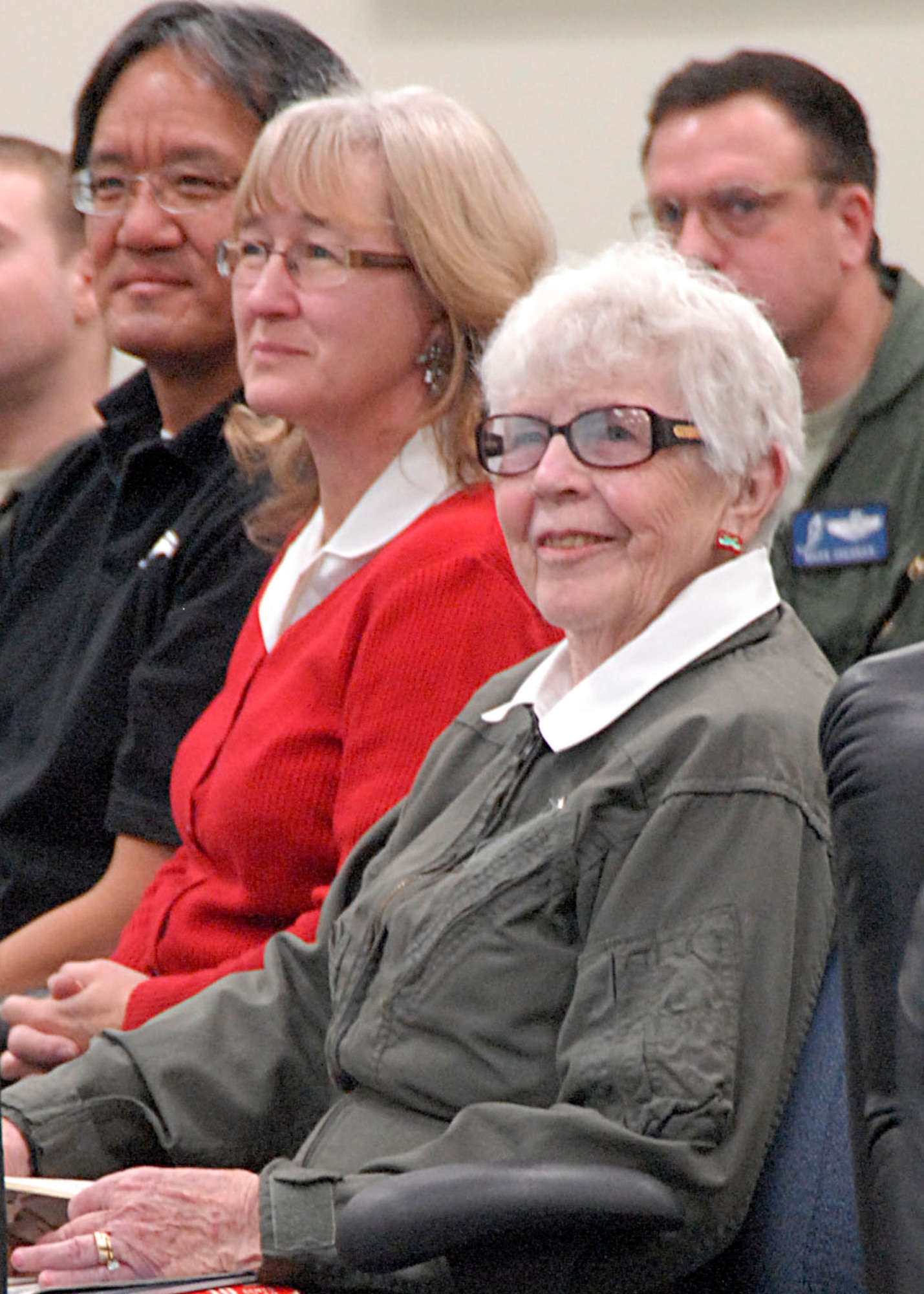 Former Women's Airforce Service Pilot, Flora Belle Reece patiently waits to address fellow flyers of the 445th Flight Test Squadron at their Commander's Call on Dec. 16. Lt. Col. Jason Schott, commander, 445th Flight Test Squadron, welcomed Flora Belle's unique perpective on aviation history, overcoming adversity, and making dreams come true. (U.S. Air Force Photo by Laura Mowry)