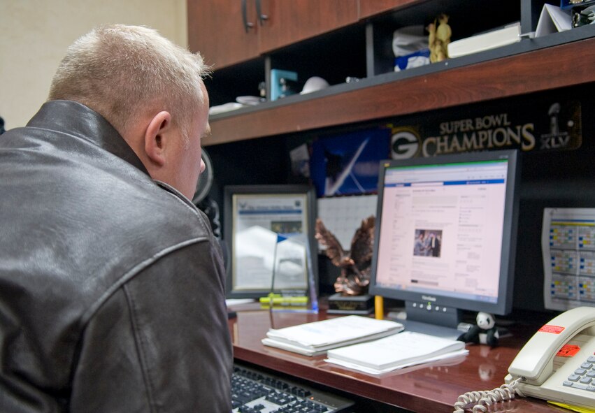 Col. Daniel Dant, Installation Excellence Award Board team member, looks at the Barksdale Facebook page at the 2nd Bomb Wing Public Affairs office on Barksdale Air Force Base, La., Jan. 9. Barksdale Public Affairs uses numerous social media platforms, to include Twitter and Youtube, to reach a worldwide audience. (U.S. Air Force photo/Airman 1st Class Benjamin Gonsier)(RELEASED)