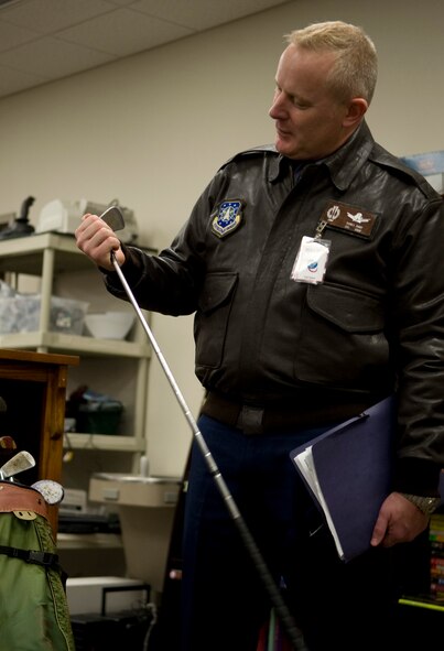 Col. Daniel Dant, Installation Excellence Award Board team member, looks at a golf club at the Airman's Attic on Barksdale Air Force Base, La., Jan. 9. Dant visited the Airman's Attic to see what products they offered Airmen and their families. (U.S. Air Force photo/Airman 1st Class Benjamin Gonsier)(RELEASED)
