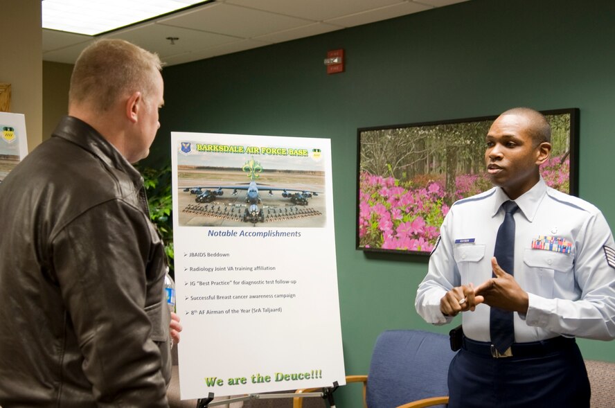 Col. Daniel Dant, Installation Excellence Award Board team member, speaks with Tech. Sgt. Terrence Raybon, 2nd Medical Support Squadron, at the 2nd Medical Group Clinic on Barksdale Air Force Base, La., Jan. 9. Raybon briefed Dant on the programs the clinic offers base Airmen and their families. (U.S. Air Force photo/Airman 1st Class Benjamin Gonsier)(RELEASED)