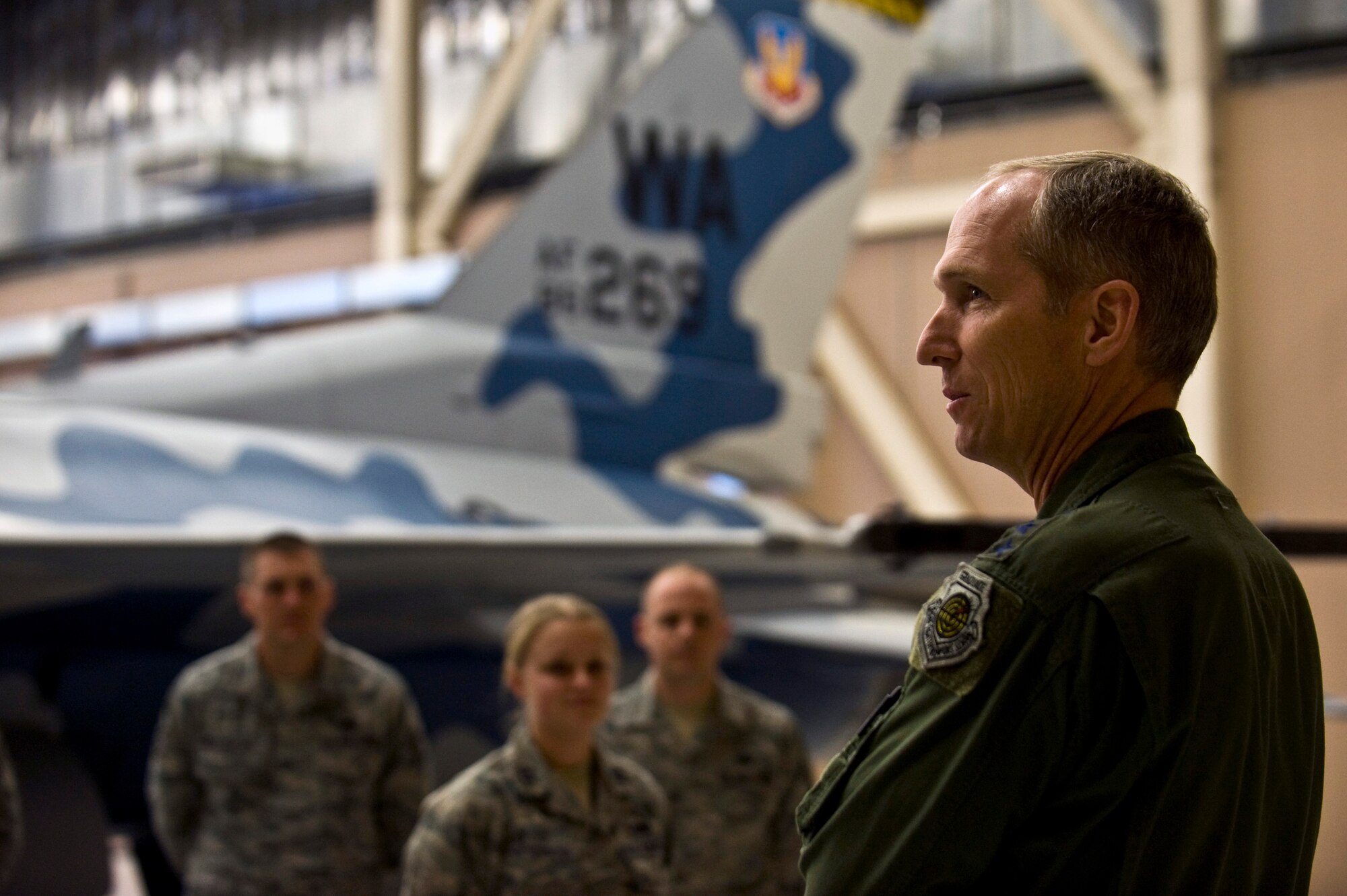 U.S. Air Force Gen. Mike Hostage, commander of Air Combat Command, addresses Airmen of the 57th Aircraft Maintenance Squadron on current events Jan. 11, 2012, inside the Viper Aircraft Maintenance Unit hangar at Nellis Air Force Base, Nev. Hostage visited Nellis to attend the Combat Air Forces Weapons and Tactics Conference and to discuss current issues, to look at future issues and to provide solutions for joint employment of forces. (U.S. Air Force photo by Senior Airman Brett Clashman/Released)