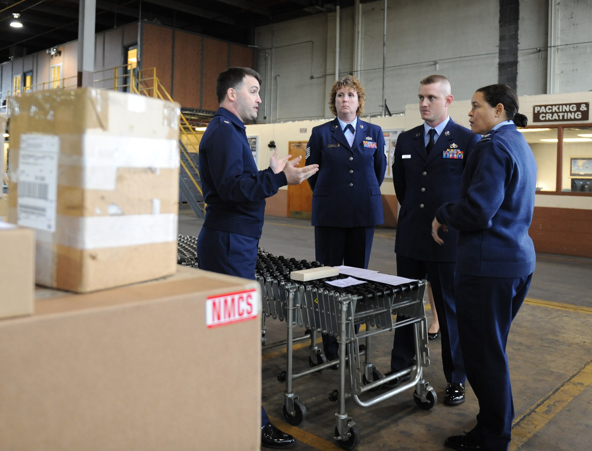 Lt. Col. Troy Koepnick, 2nd Logistics Readiness Squadron commander, informs Col. Amanda Gladney, Installation Excellence Selection Board team member, about the squadron's daily operations on Barksdale Air Force Base, La., Jan. 9. The IES Board visited Barksdale to inspect the base's quality-of-life programs. Barksdale is one of two finalist selected for the Commander in Chief's Annual Installation Excellence Award. (U.S. Air Force photo/Airman 1st Class Micaiah Anthony)(RELEASED)