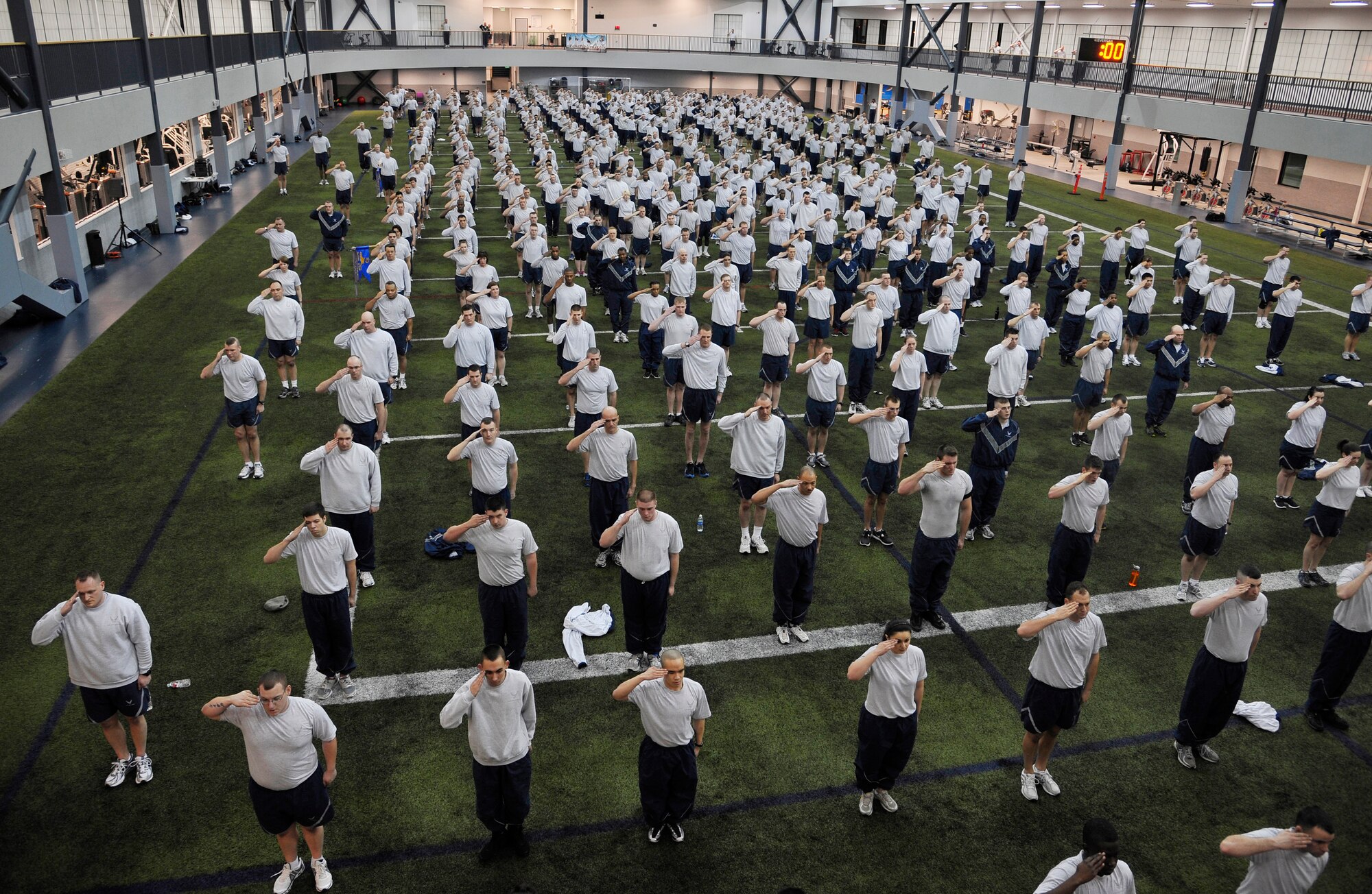 U.S. Air Force Airmen assigned to the 354th Fighter Wing salute the U.S. Flag during Fit Flag Jan. 13, 2012, Eielson Air Force Base, Alaska. Fit Flag is a fitness program that challenges each Airman through a variety of rigorous exercises to improve overall health and to keep Airmen fit to fight. (U.S. Air Force photo by Staff Sgt. Christopher Boitz/Released)