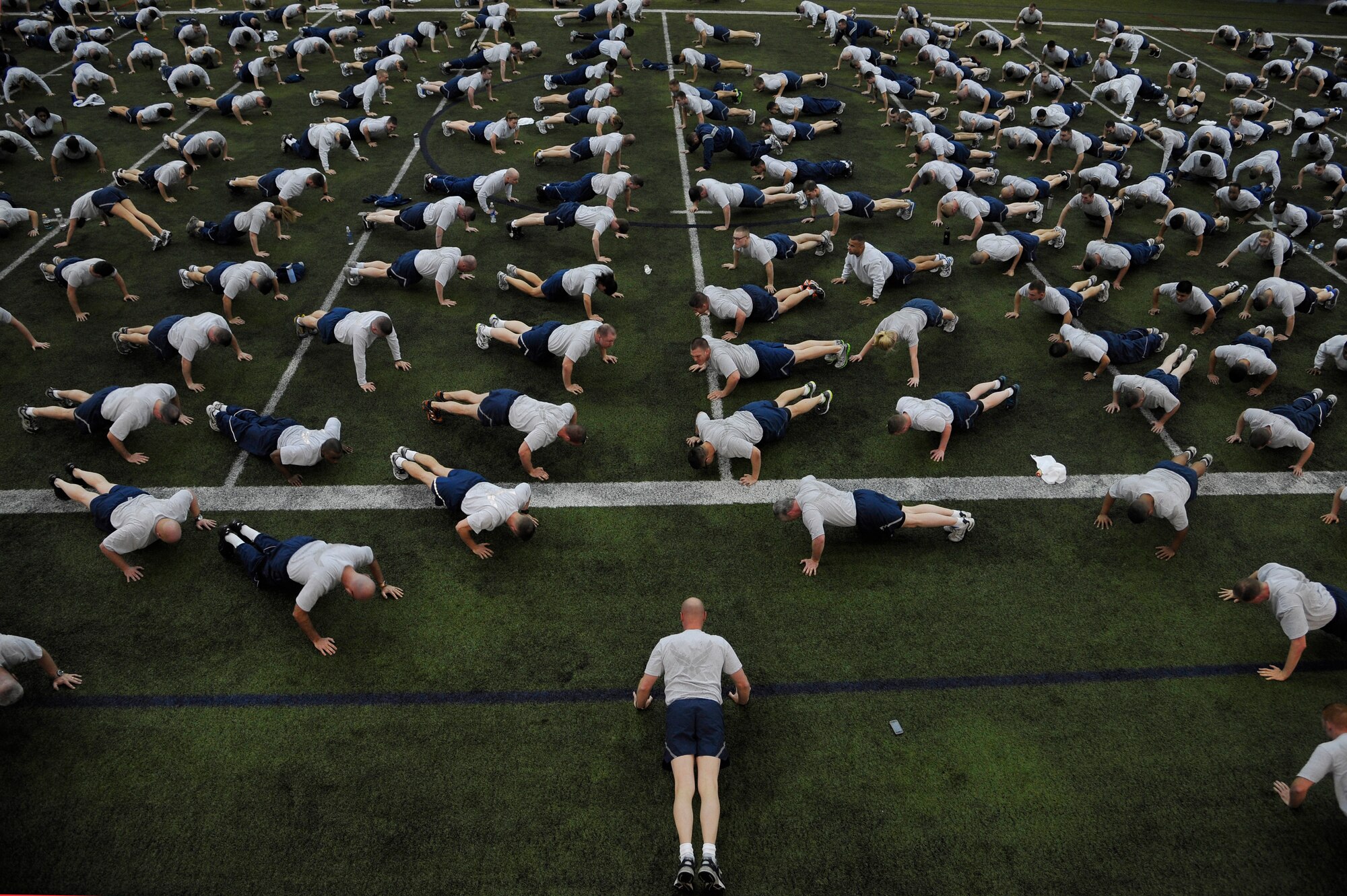 U.S. Air Force Brig. Gen. James Post leads the Iceman team through a series of exercises during Fit Flag Jan. 13, 2012, Eielson Air Force Base, Alaska. Fit Flag is an organized physical fitness program designed to keep Airmen fit to fight and to build camaraderie. Post is the 354th Fighter Wing commander. (U.S. Air Force photo by Staff Sgt. Christopher Boitz/Released)