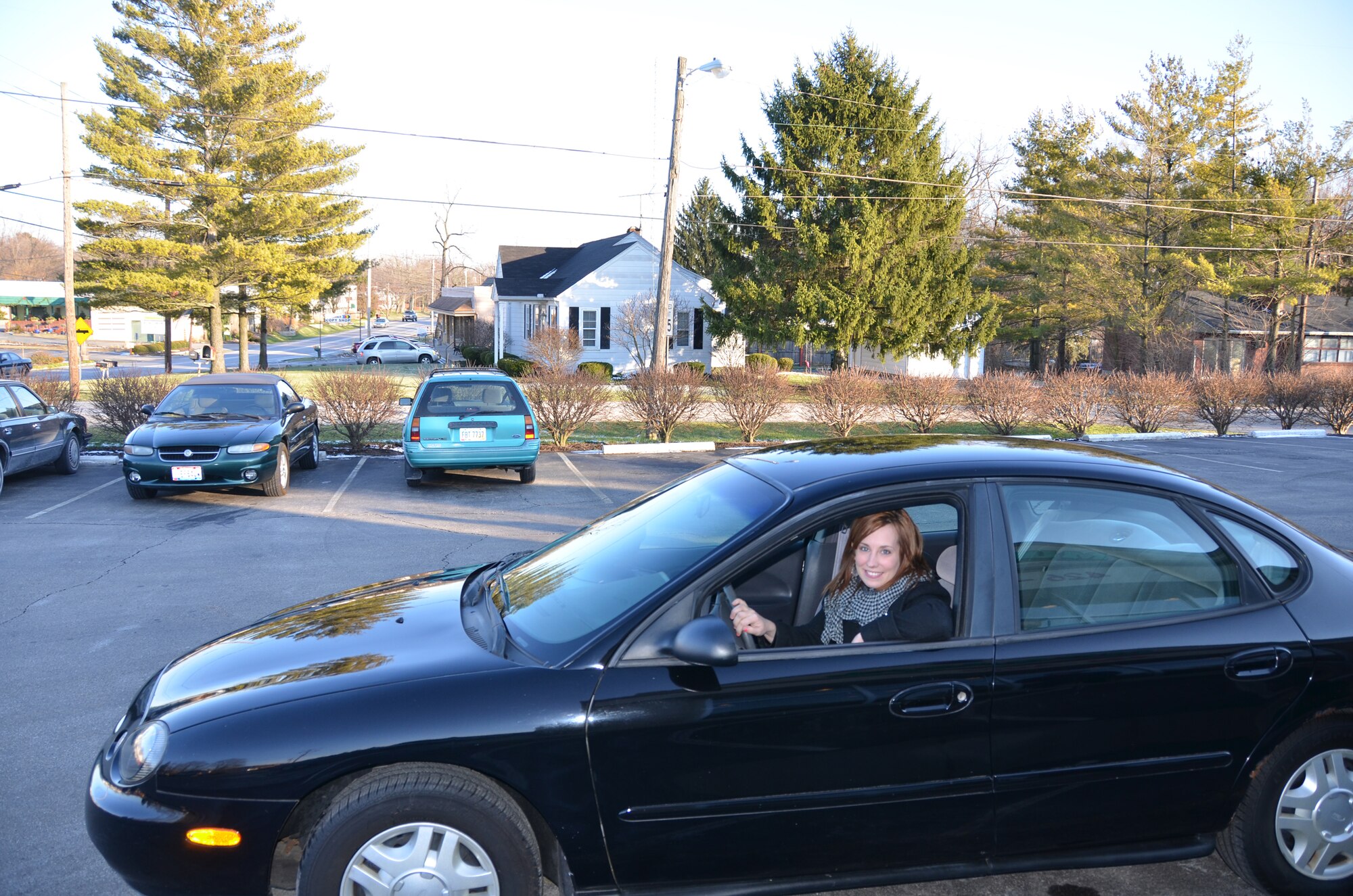 WRIGHT-PATTERSON AIR FORCE BASE, Ohio – Staff Sgt. Traci Todahl, 445th Aeromedical Staging Squadron mental health technician,  enjoys her new Ford Taurus Jan. 4. The car was donated by Murphy’s Autocare of Beavercreek, Ohio, as part of the Charity Cars program. Dave and Jan Murphy, owners of Murphy’s Autocare, along with other organizations are participants in the Charity Cars program that donates vehicles to those who are in need. This is the third vehicle the Murphys have donated to a member of the wing. (U.S. Air Force photo/Lt. Col. Cynthia Harris)