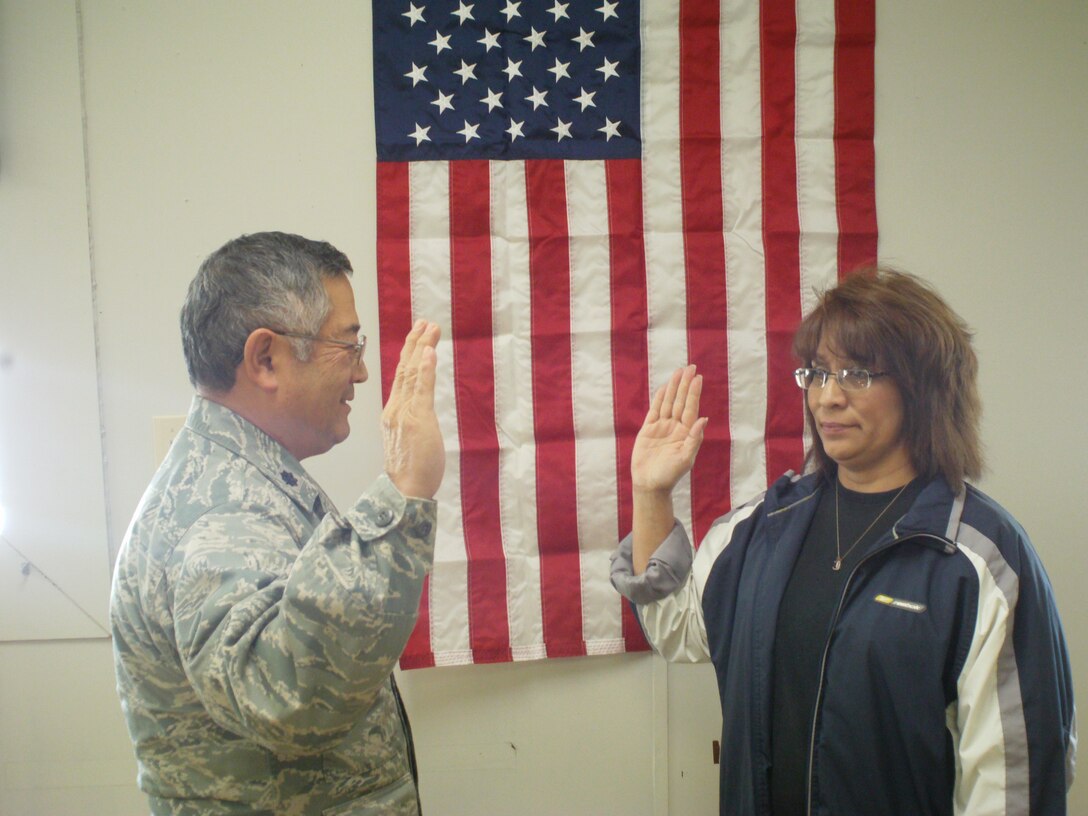 Airman 1st Class Clara Truly is the first local recruit to be sworn in by Lt. Col. Ron Soejoto during their first Unit Training Assembly Dec. 10, 2011 at Sheppard Air Force Base, Texas. The 4th Air Wing, Texas State Guard and Sheppard Air Force Base signed a memorandum of agreement Nov. 17, and stood up a new unit at Sheppard assigned to the 482nd Air Support Group. (U.S. Air Force courtesy photo)