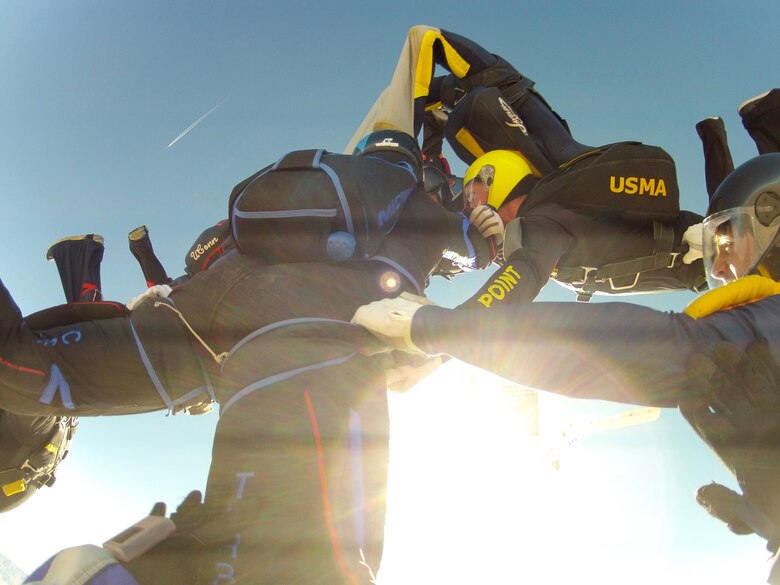 Jumpers link up in an attempt to break a three-point, 32-way collegiate sequential record during a parachuting competition in Eloy, Ariz. The Air Force Wings of Blue Parachute Team won several medals in the event, held Dec. 28, 2011 to Jan. 2, 2012, capturing the collegiate championship. (U.S. Air Force photo/Lt. Col. Mike Love)