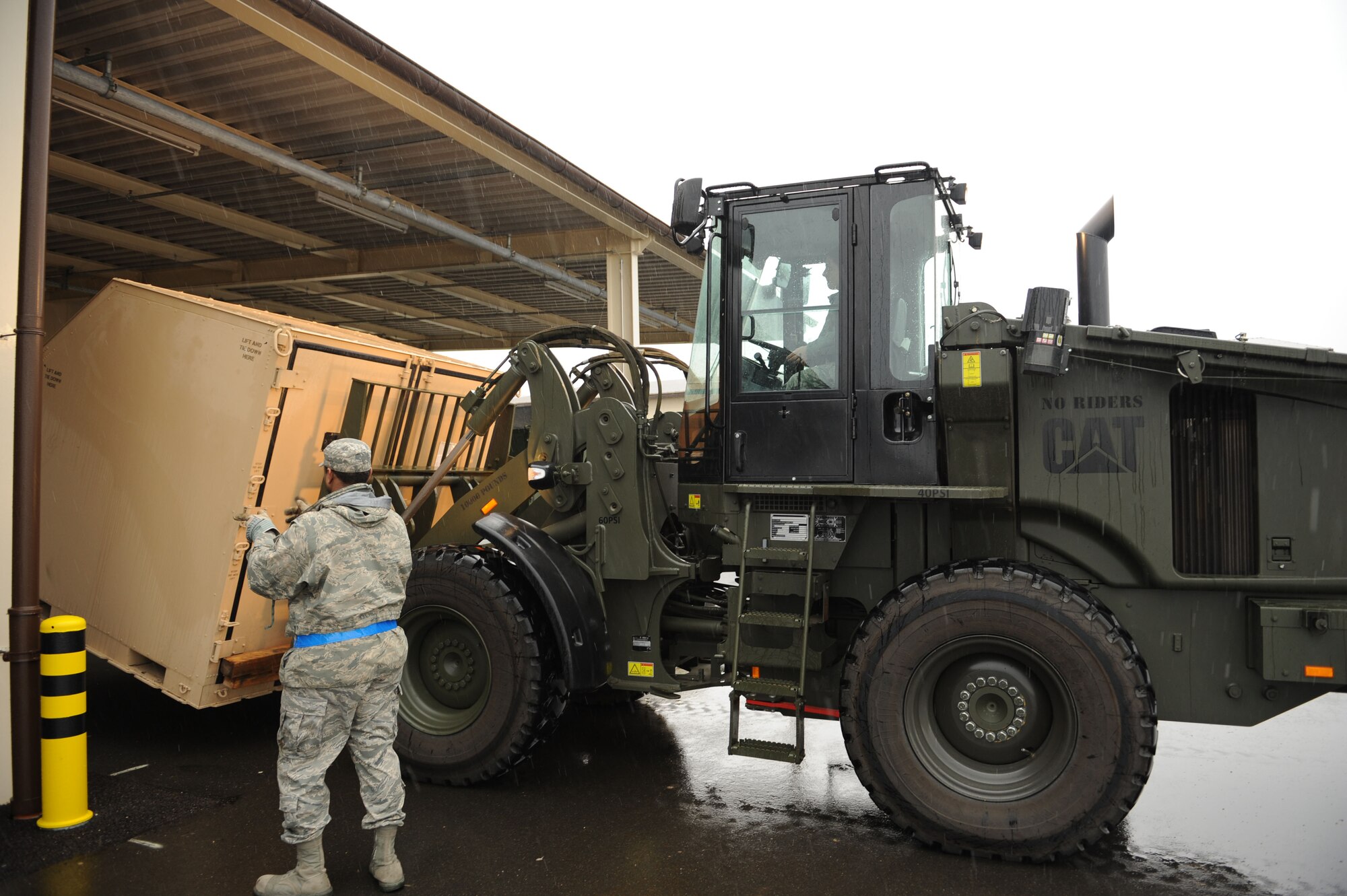 SPANGDAHLEM AIR BASE, Germany – Airmen from the 52nd Logistics Readiness Squadron Vehicle Operations Element, use a forklift to drop off cargo at the 606th Air Control Squadron during a cargo movement here Jan 13. The element supports the 52nd Fighter Wing and its tenant units by transporting cargo to and from squadrons on base, to include transient aircraft. These Airmen are responsible for getting aircrew and cargo to the aircraft, delivering mission critical parts and supplies to the base, providing vehicles to customers for official appointments and GOV licensing for the entire base. (U.S. Air Force photo/Senior Airman Christopher Toon)