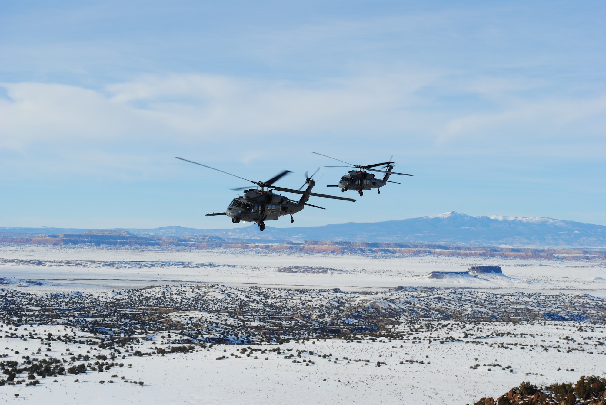 A pair of HH-60Gs assigned to the 512th Rescue Squadron fly in formation Dec. 28. U.S. Air Force Photo by John Cochran.