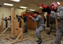MINOT AIR FORCE BASE, N.D -- Members of the 5th Security Forces Squadron response force team, perform asset recovery and recapture exercises here Jan. 12, in preparation for a Defense Nuclear Surety Inspection. The DNSI will be held during the month of February. (U.S. Air Force photo/Senior Airman Desiree W. Esposito)