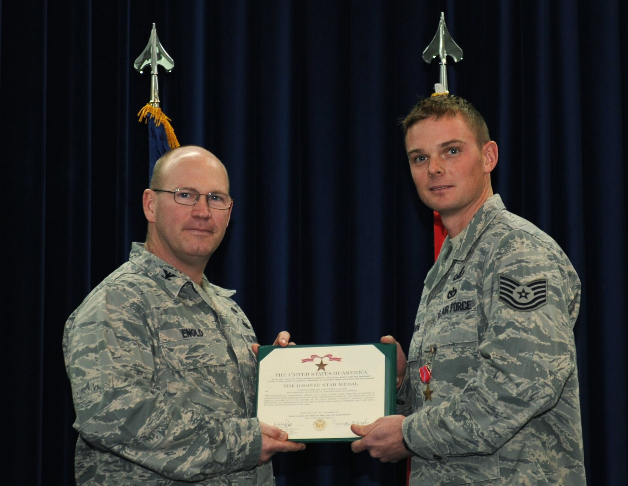 Tech. Sgt. Christopher Jackson, 39th Civil Engineer Squadron explosive ordinance disposal team leader, receives the Bronze Star from Col. Scott Enold, 39th Mission Support Group commander, Jan. 12, 2012, at Incirlik Air Base, Turkey.  Jackson earned the Bronze Star for his actions while deployed in support of Operation Enduring Freedom. (U.S. Air Force photo by Senior Airman Anthony Sanchelli/Released)

