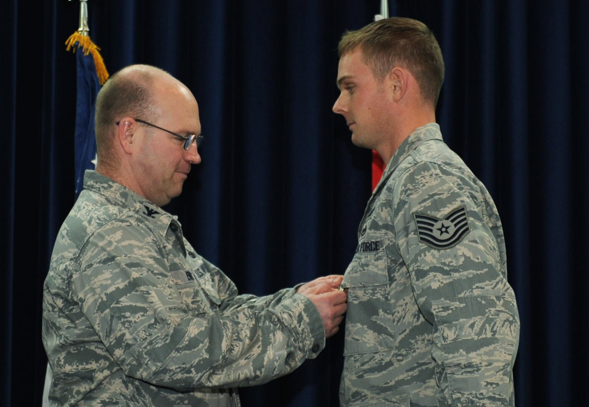 Tech. Sgt. Christopher Jackson, 39th Civil Engineer Squadron explosive ordinance disposal team leader, receives the Bronze Star from Col. Scott Enold, 39th Mission Support Group commander, Jan. 12, 2012, at Incirlik Air Base, Turkey.  Jackson earned the Bronze Star for his actions while deployed in support of Operation Enduring Freedom. (U.S. Air Force photo by Senior Airman Anthony Sanchelli/Released)
