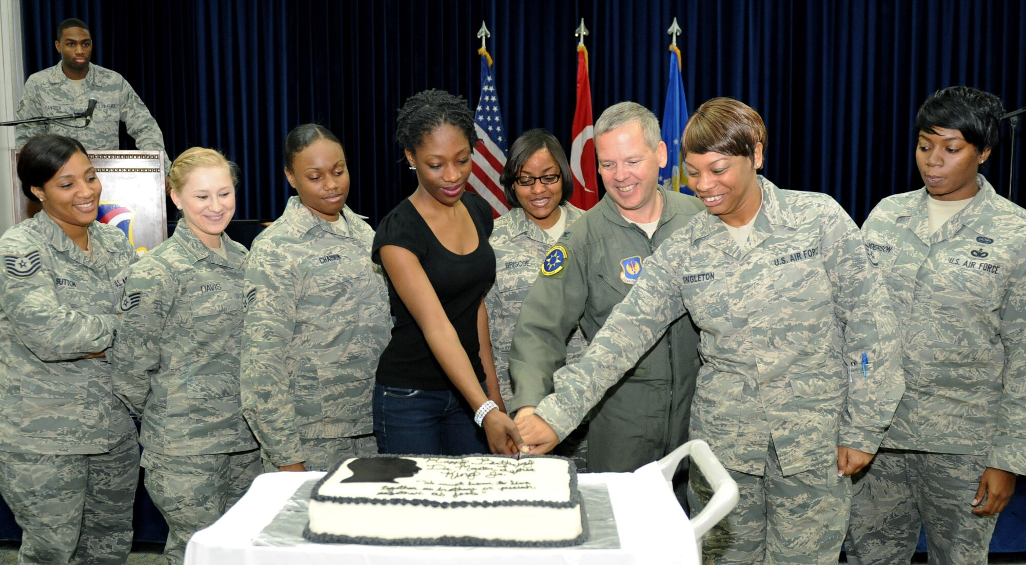 Col. Chad Butts, 39th Air Base vice commander, center right, and Martin Luther King Day committee members, cut a cake during a remembrance luncheon for Dr. Martin Luther King Jr. Jan. 13, 2012, at Incirlik Air Base, Turkey. King is remembered for his "I Have a Dream" speech in Washington, D.C., to 250,000 people following a peaceful march Aug. 28, 1963. (U.S. Air Force photo by Senior Airman Anthony Sanchelli/Released)
