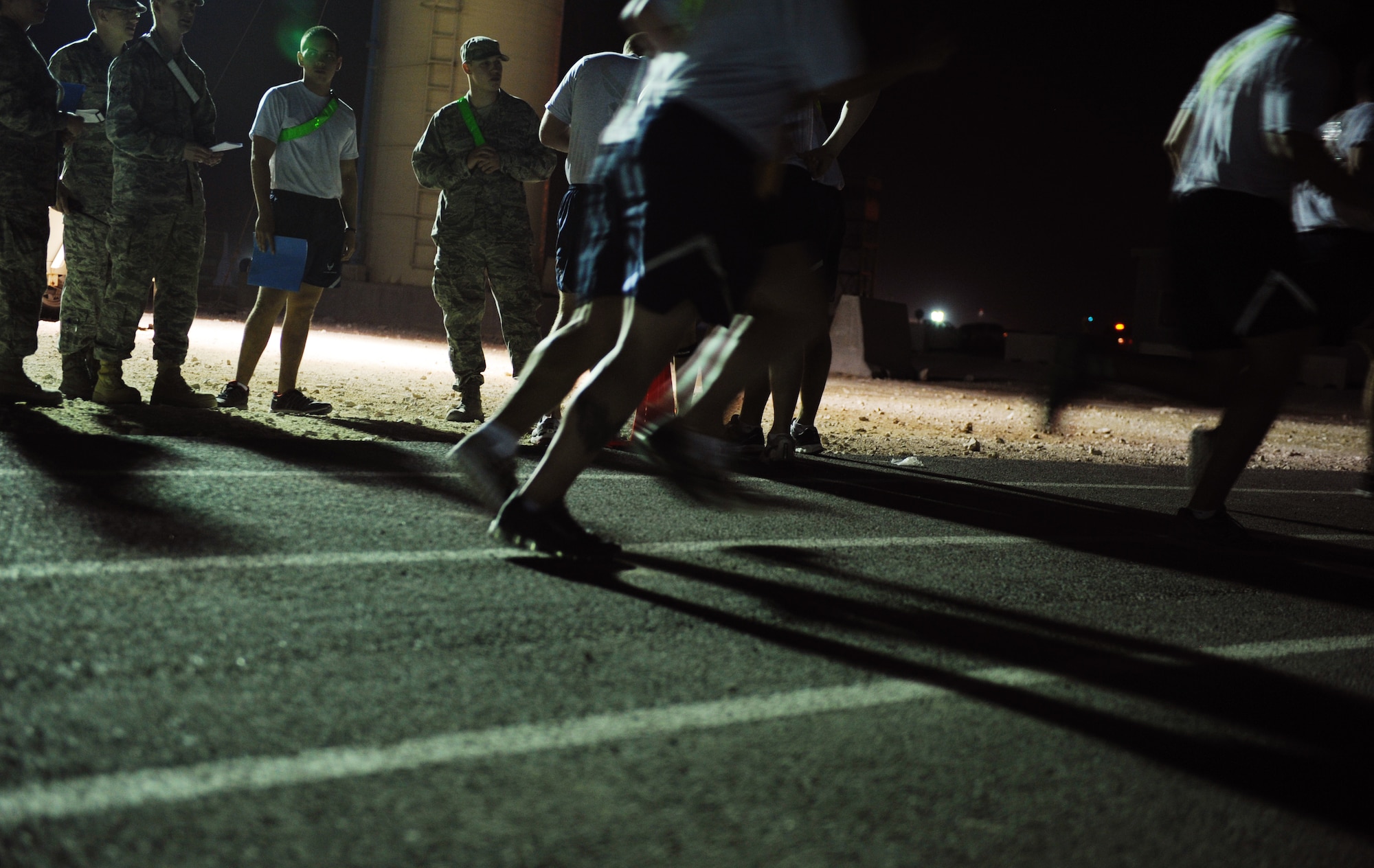 SOUTHWEST ASIA – Airmen from the 379th Air Expeditionary Wing run in a relay during the Warrior Challenge here Jan. 11, 2012. The event consisted of games, riddles, and obstacles that reflected the four components of Comprehensive Airman Fitness---physical, social, spiritual and mental. The purpose of the event was to increase awareness of CAF and to help promote a wingman culture. (U.S. Air Force photo/Staff Sgt. Nathanael Callon)