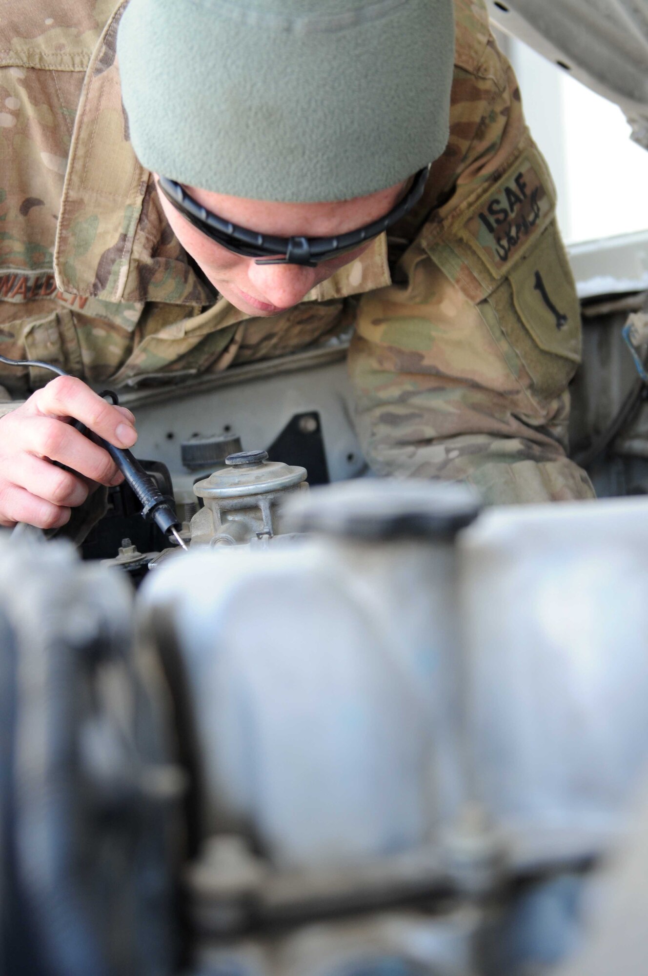 PAKTYA PROVINCE, Afghanistan—U.S. Air Force Staff Sgt. Corrie Walden, vehicle maintainer from Bothell, Wash., uses a multimeter to troubleshoot a vehicle in Paktya Province Jan. 6, 2012. Mulitmeters measure voltage, current and resistance of a vehicle’s engine. (U.S. Air Force photo/1st Lt. Cammie Quinn)