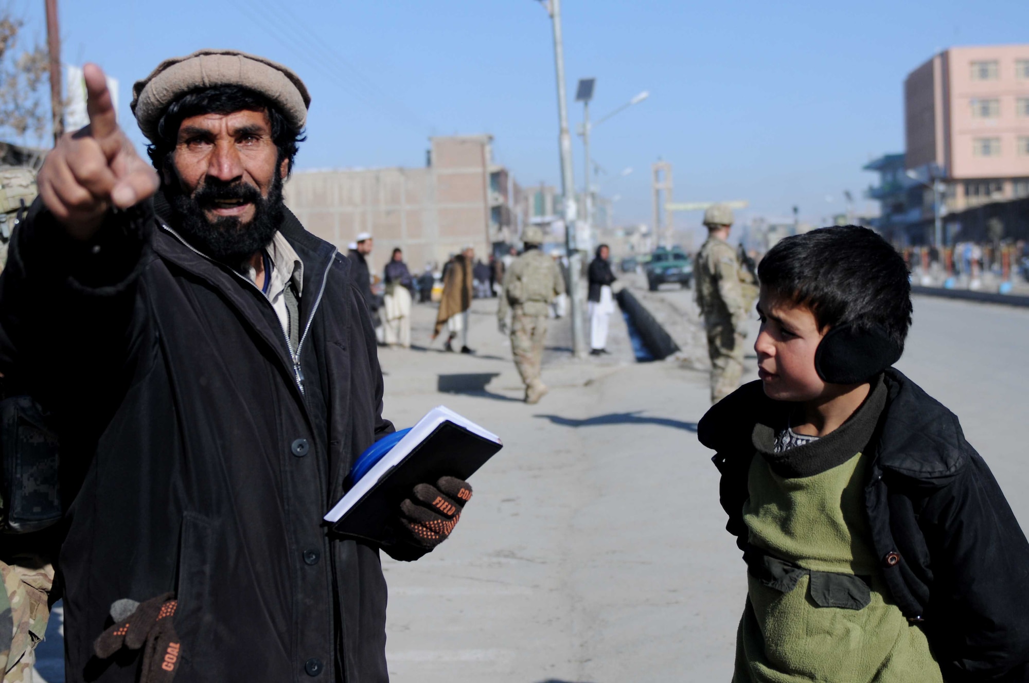PAKTYA PROVINCE, Afghanistan - Laolo Edin, Paktya Province director of power, points to future sites for poles to support an electricity project in Paktya Province Jan. 9, 2012. Electricity is a sign of progress and allows the Afghan government to reach into homes and expand positive service delivery for their people. (U.S. Air Force photo/1st Lt. Cammie Quinn)