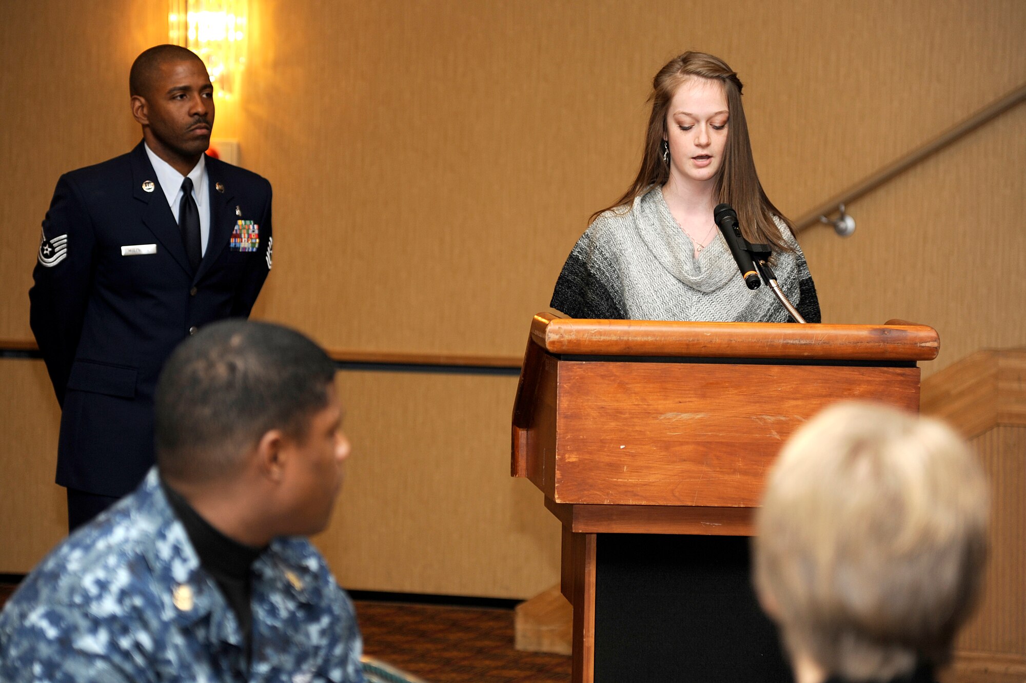 MISAWA AIR BASE, Japan - Emma Harrison, daughter of Mr. David Harrison, Misawa Security Operations Center, reads her poem titled "Black and White" during the annual Martin Luther King Jr. luncheon held at the collocated club here, Jan. 12. This year's theme is "A day on, not a day off." (U.S. Air Force photo/Tech. Sgt. Marie Brown)