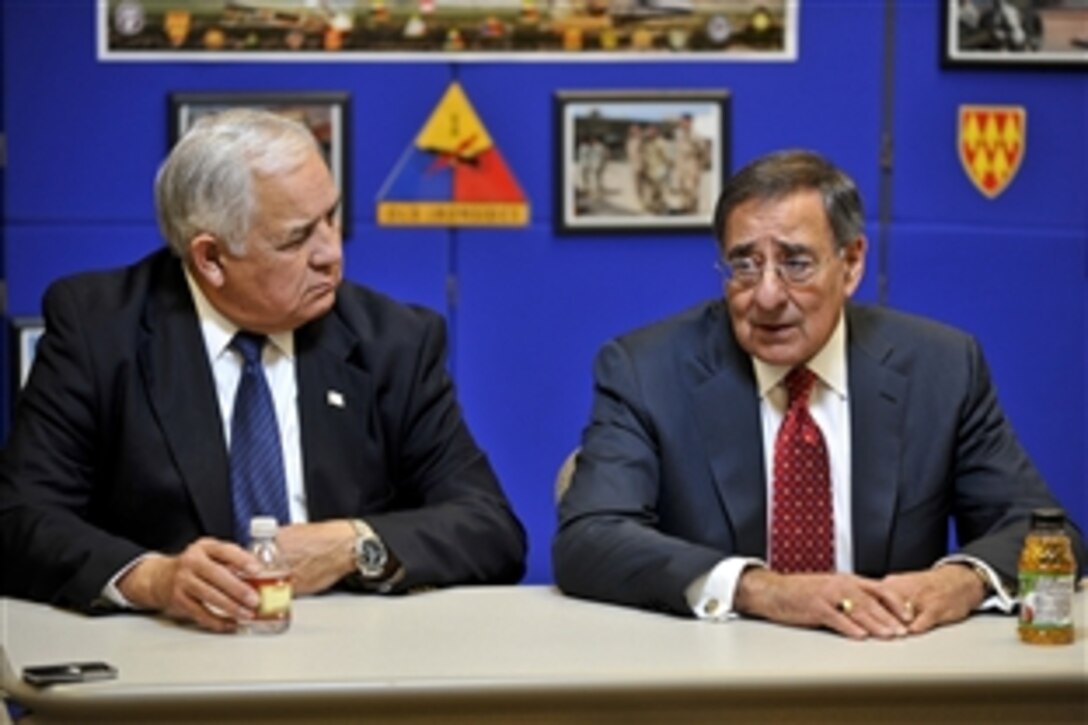 Defense Secretary Leon E. Panetta, right, answers questions during a press briefing with U.S. Rep. Silvestre Reyes of Texas on Fort Bliss during a visit to El Paso, Texas, Jan. 12, 2012.