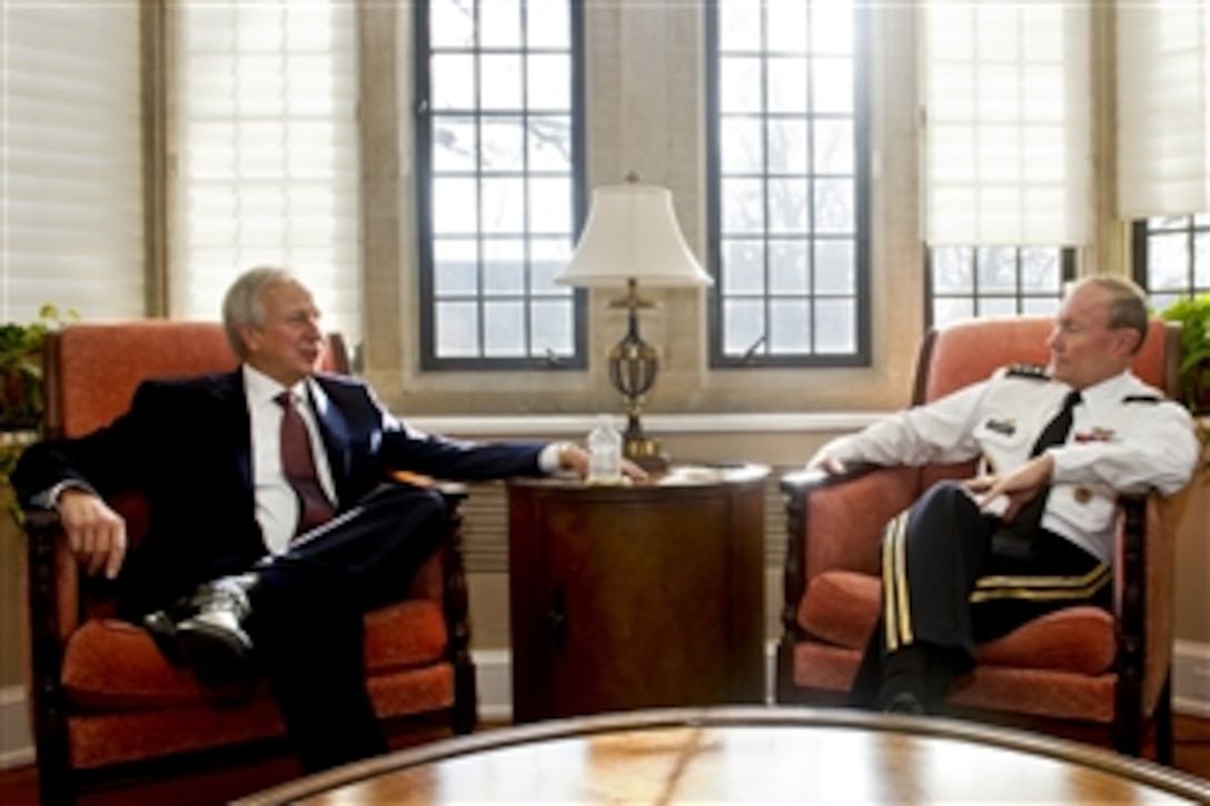 Duke University President Richard H. Brodhead, left, meets with Army Gen. Martin E. Dempsey, chairman of the Joint Chiefs of Staff, at the university in Durham, N.C., Jan. 12, 2012.