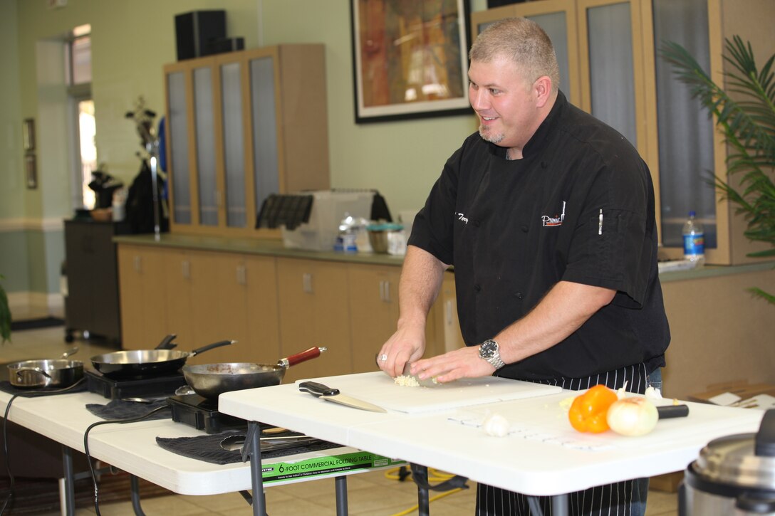 Chef Terry Rademann cuts vegetables during Midway Parks Community Center’s Cooking Class in Midway Park, a housing community of Marine Corps Base Camp Lejeune, Jan. 14. The cooking classes feature different themes and happen monthly.