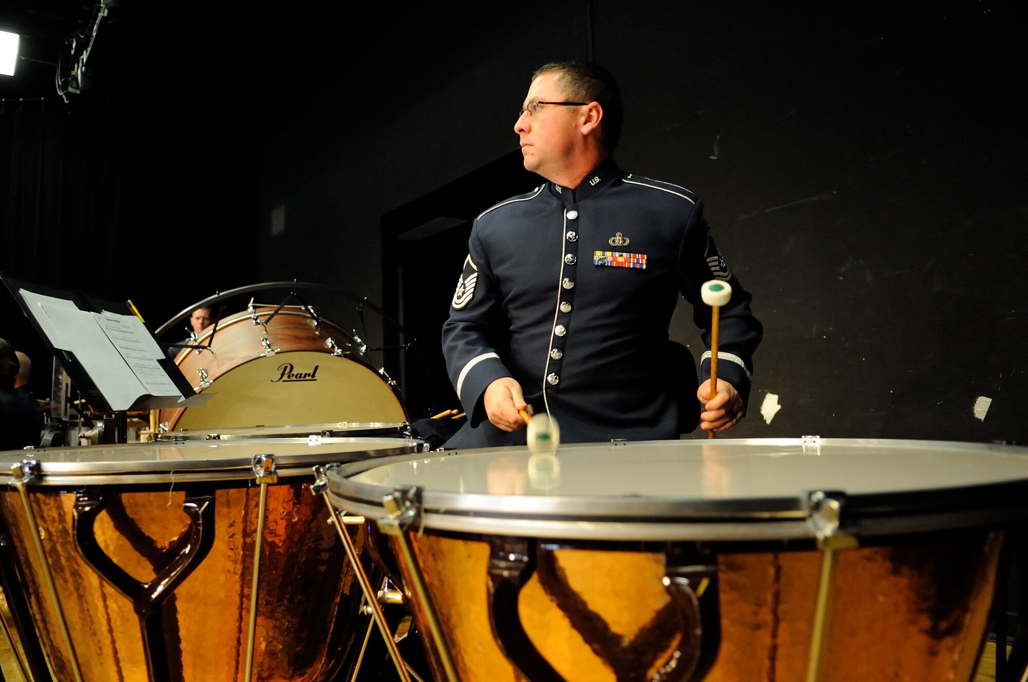 U.S. Air Force Master Sgt. Thomas Rarick, a percussionist with the U.S. Air Force Band Ceremonial Brass and a native of Carlisle, Pa., plays during a concert at The First Academy Faith Hall in Orlando, Fla., Jan. 14, 2011.  The Ceremonial Brass honored Tuskegee Airmen, the first African American military aviators in the U.S. armed forces, during their performance, playing a new work entitle "Red Tail Skirmish."  U.S. Air Force photo by Master Sgt. Adam M. Stump/Released.
