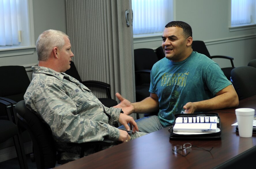 Capt. Richard Holmes, 2nd Maintenance Squadron chaplain converses with Patrick Catanese on Barksdale Air Force Base, La., Jan. 11. Holmes is a leading member in instructing "Question, Persuade, Refer", a program that teaches staff sergeants and above who are new to the base and senior airmen attending Airman Leadership School to look for signs of suicidal thoughts. (U.S. Air Force photo/Airman 1st Class Andrew Moua)(RELEASED