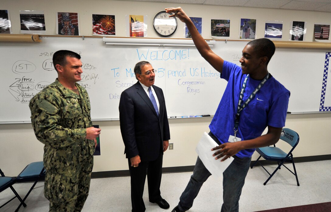 Defense Secretary Leon E. Panetta talks about basketball with a John L. Chapin High School student in El Paso, Texas, Jan. 13, 2012.