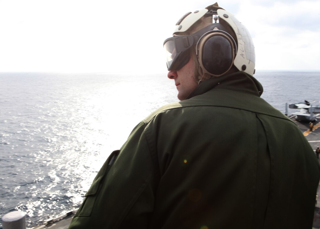 A French military representative watches MV-22 Ospreys, with Marine Medium Tilt Rotor Squadron 263 (Reinforced), 22nd Marine Expeditionary Unit (MEU), during flight operations aboard USS Bataan, Jan. 14, 2012. Twelve French military representatives flew to USS Bataan to learn about and inspect MV-22 Ospreys to ensure the Osprey could be cross-decked to French ships in future operations. The Marines and sailors of the 22nd MEU are currently deployed with Amphibious Squadron 6 aboard the USS Bataan Amphibious Ready Group.  The 22nd MEU is a multi-mission, capable force, comprised of an Aviation Combat Element, Marine Medium Tilt Rotor Squadron 263 (Reinforced); a Logistics Combat Element, Combat Logistics Battalion 22; a Ground Combat Element, Battalion Landing Team, 2nd Battalion, 2nd Marine Regiment; and its Command Element.