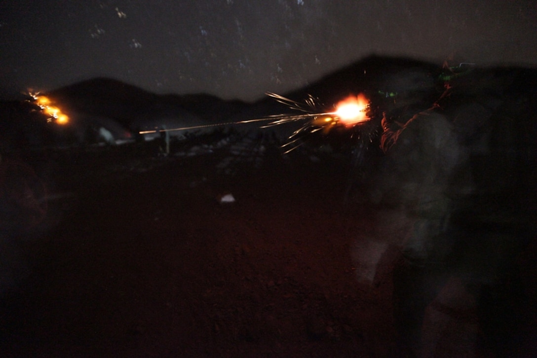 Reconnaissance Marines and a corpsman participate in a nighttime live-fire exercise here Jan. 14. The Marines and sailor serve with Battalion Landing Team 3/1, the ground combat element for the 11th Marine Expeditionary Unit. The unit is currently providing support for maritime security operations and theater security cooperation efforts in the U.S. 5th Fleet area of responsibility.