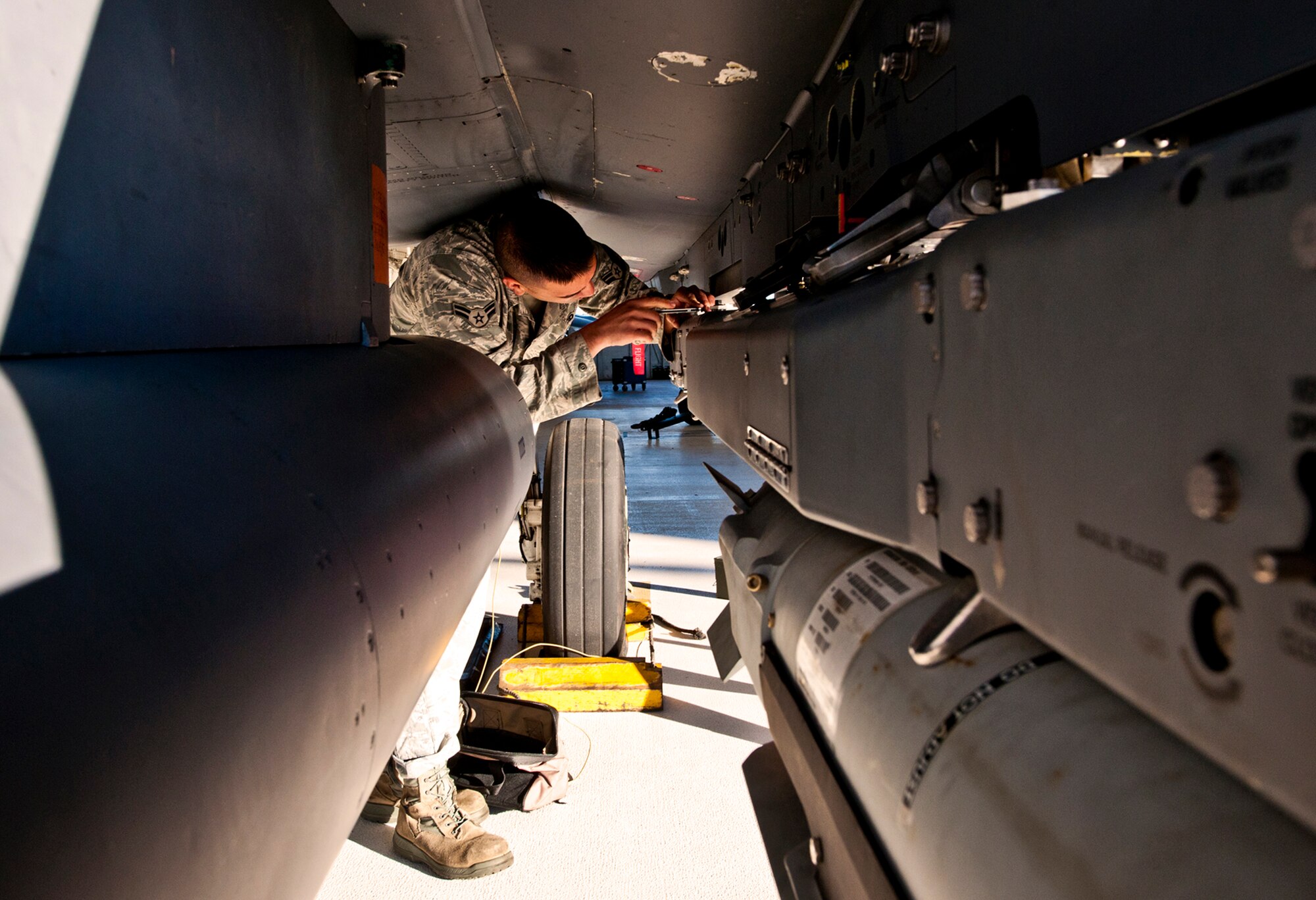 Airman 1st Class Christopher Rose, of the 46th Aircraft Maintenance Squadron, prepares the F-15 for the small diameter bomb load Jan. 13 during the 46th Maintenance Group's year-end weapons load competition at Eglin Air Force Base, Fla.  The best of the best from 46th AMXS met to load a Joint Direct Attack Munition and AIM-9 and a SDB onto an F-15. The winners will be announced at the 46th MXG annual awards banquet in March. (U.S. Air Force photo/Samuel King Jr.)