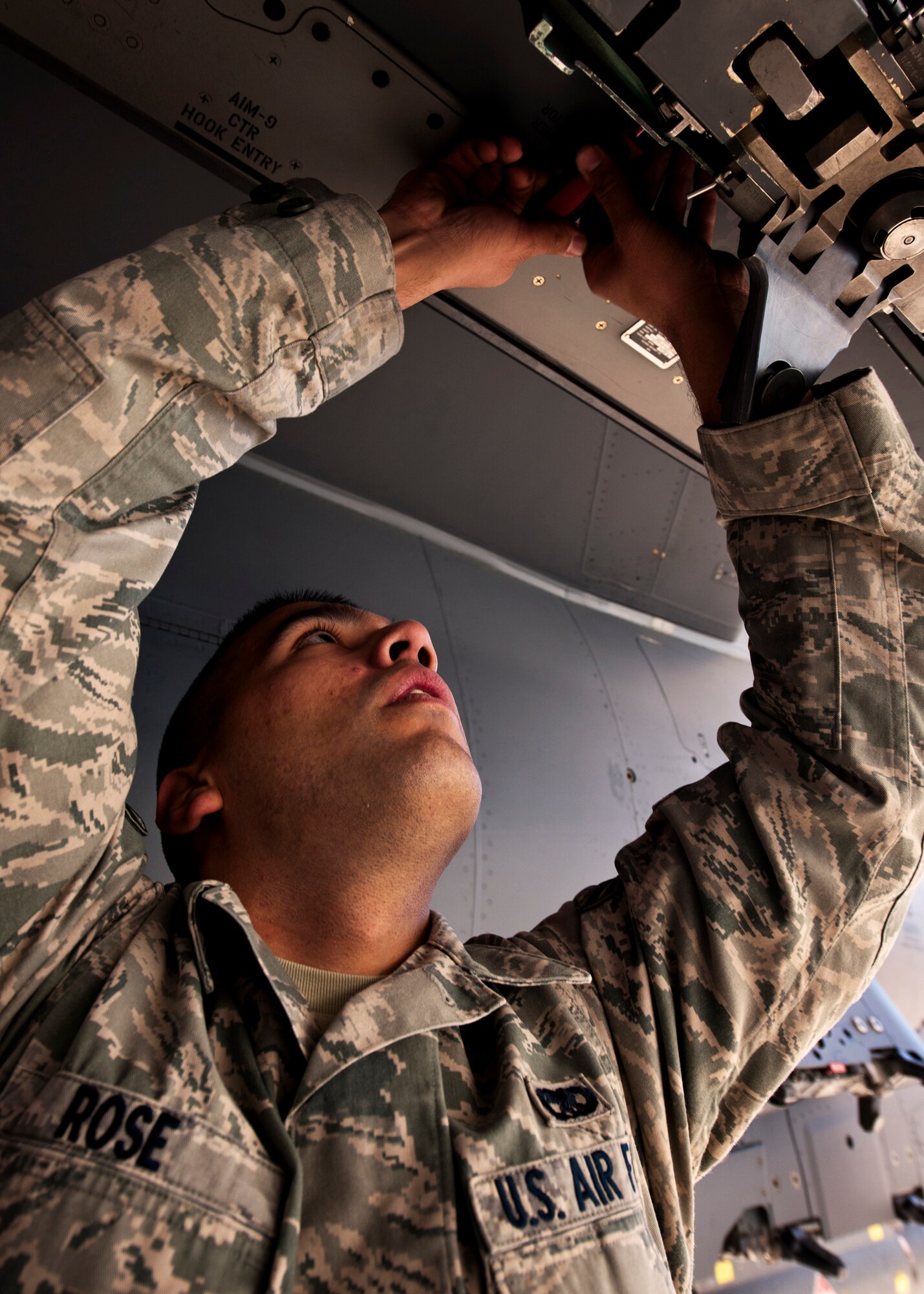 Airman 1st Class Christopher Rose, of the 46th Aircraft Maintenance Squadron, prepares the F-15 for the AIM-9 missile Jan. 13 during the 46th Maintenance Group's year-end weapons load competition at Eglin Air Force Base, Fla.  The best of the best from 46th AMXS met to load a Joint Direct Attack Munition and AIM-9 and a small diameter bomb onto an F-15. The winners will be announced at the 46th MXG annual awards banquet in March.  (U.S. Air Force photo/Samuel King Jr.)