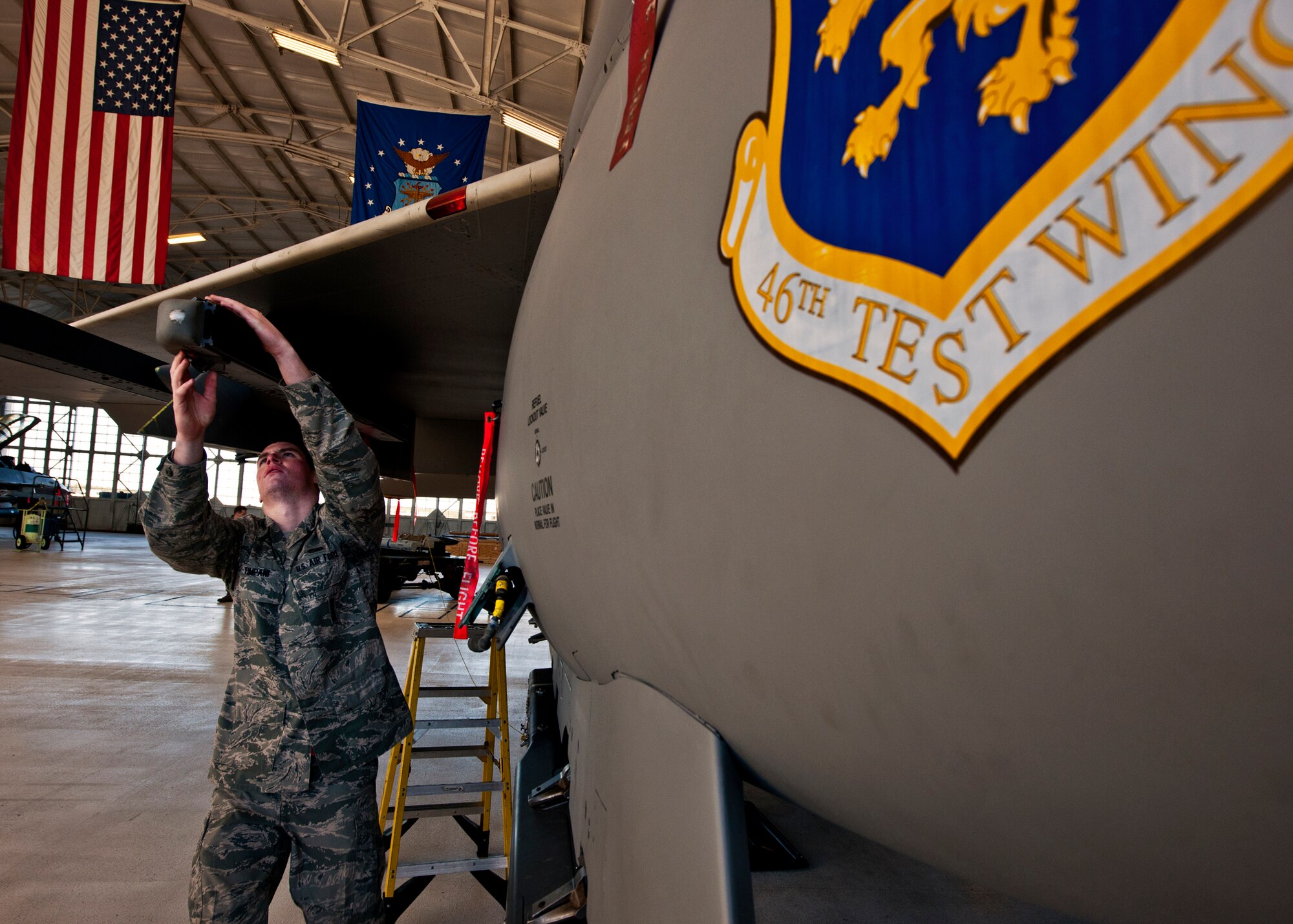 Airman 1st Class Mark Timpani, of the 46th Aircraft Maintenance Squadron, prepares the F-15 for the AIM-9 missile Jan. 13 during the 46th Maintenance Group's year-end weapons load competition at Eglin Air Force Base, Fla.  The best of the best from 46th AMXS met to load a Joint Direct Attack Munition and AIM-9 and a small diameter bomb onto an F-15. The winners will be announced at the 46th MXG annual awards banquet in March. (U.S. Air Force photo/Samuel King Jr.)